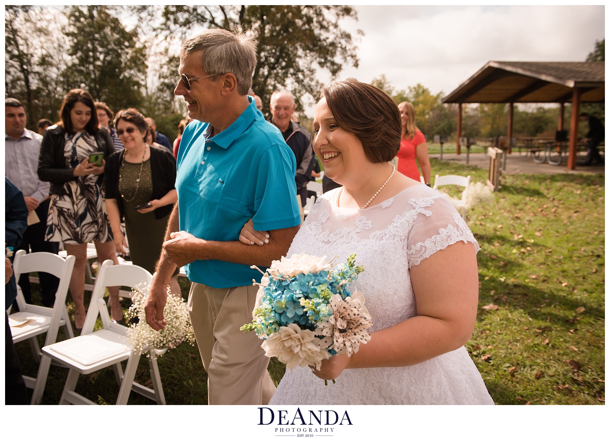 bride walking down aisle with dad