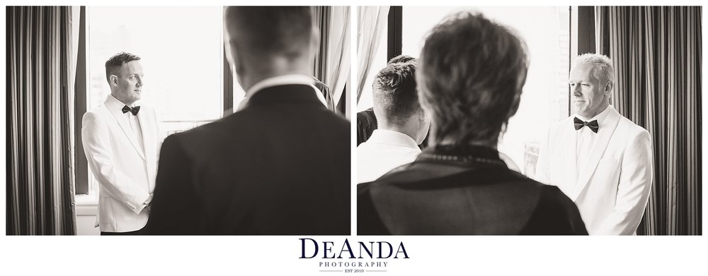 grooms during their gay wedding in black and white