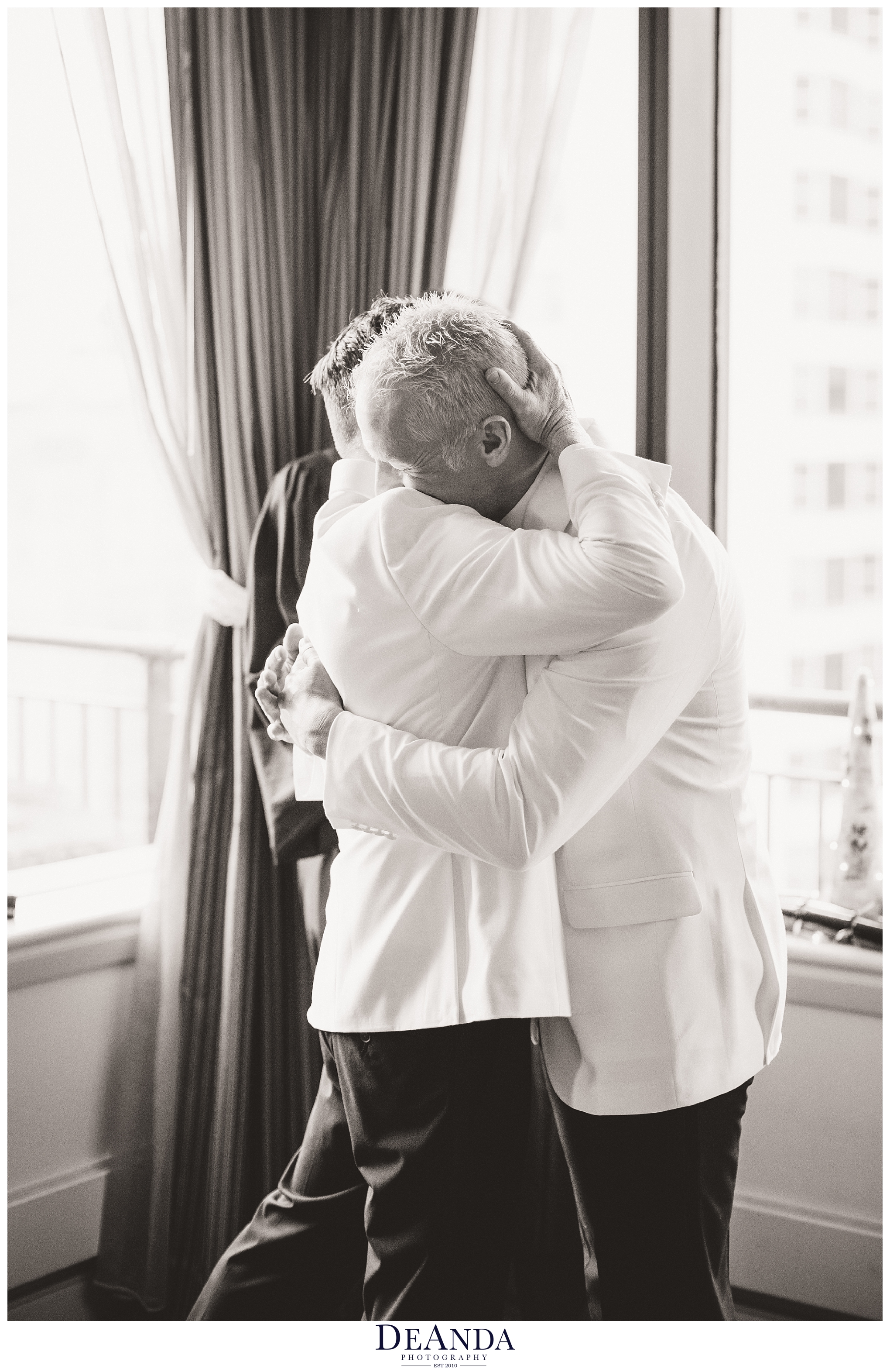 grooms embrace after being wed