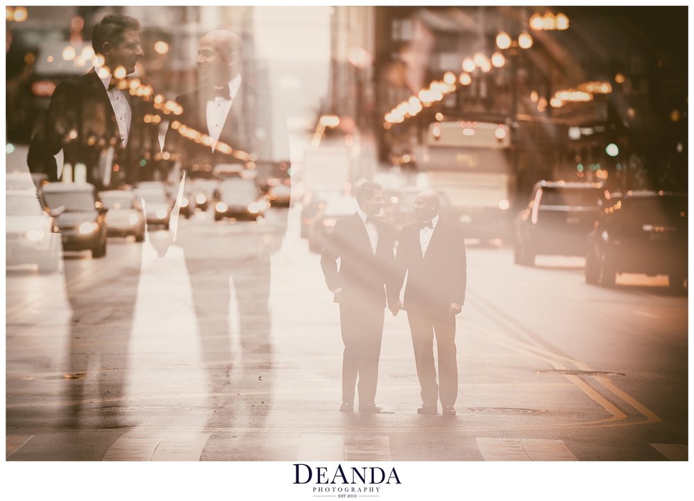 artistic image of two grooms on street in chicago on wedding day