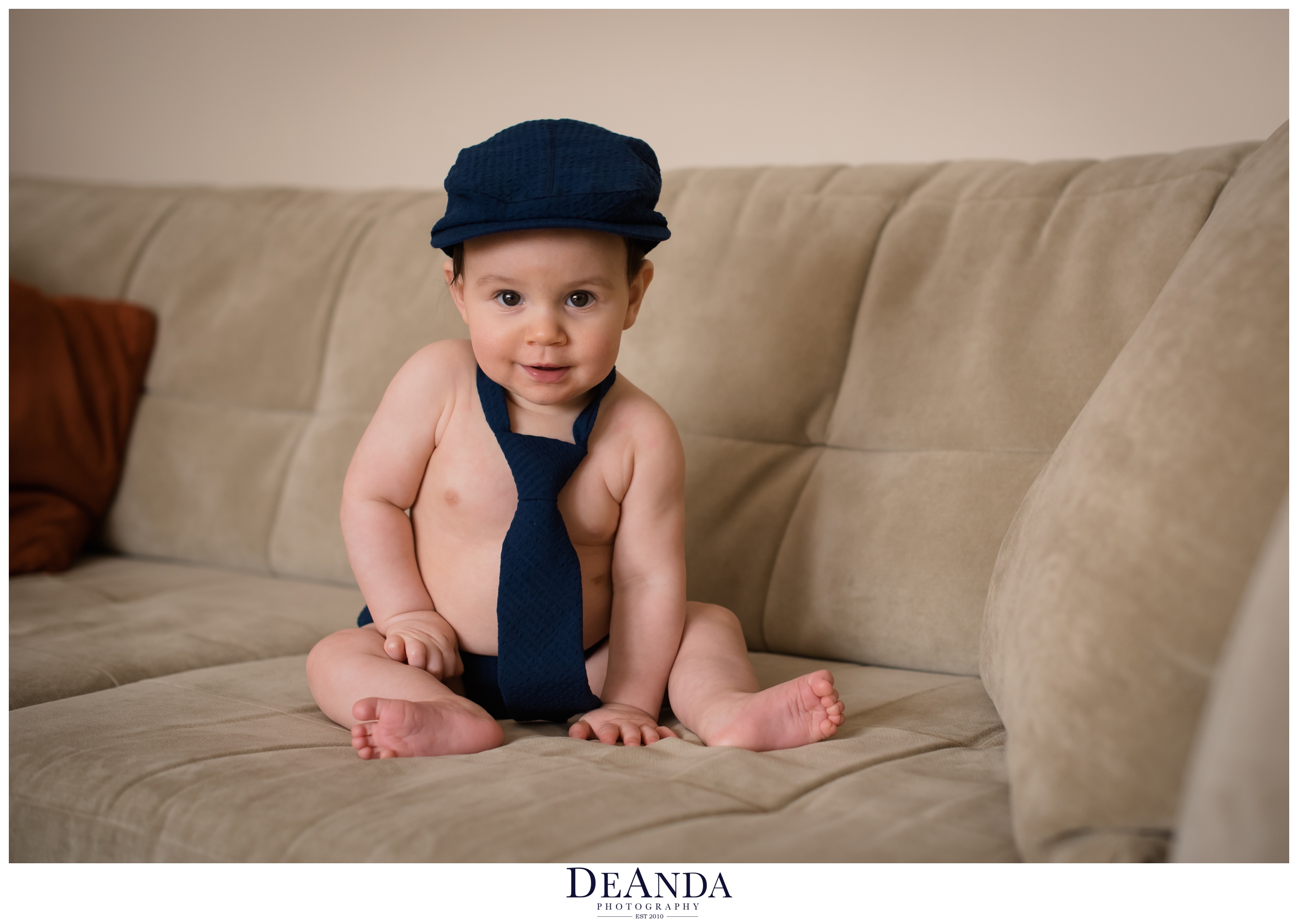 7 month old in hat and tie