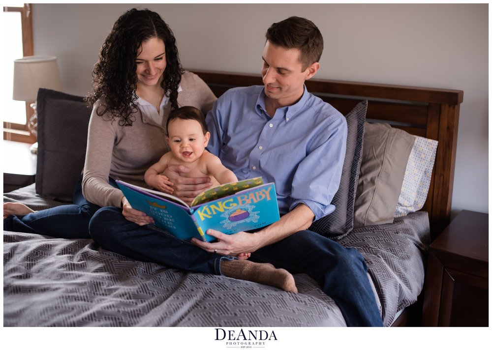 mom and dad reading king baby