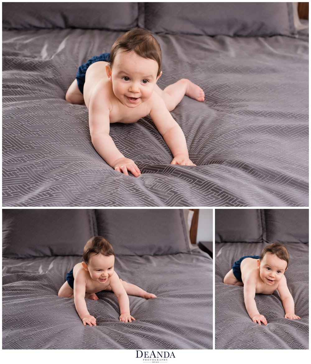baby crawling on bed for photos at 7 months
