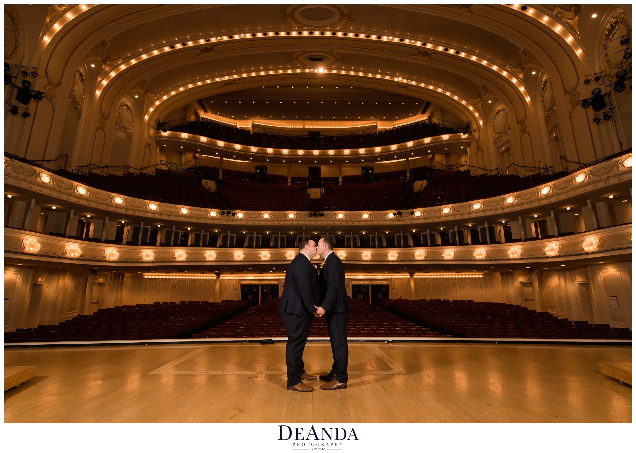 grooms kissing on symphony center stage 