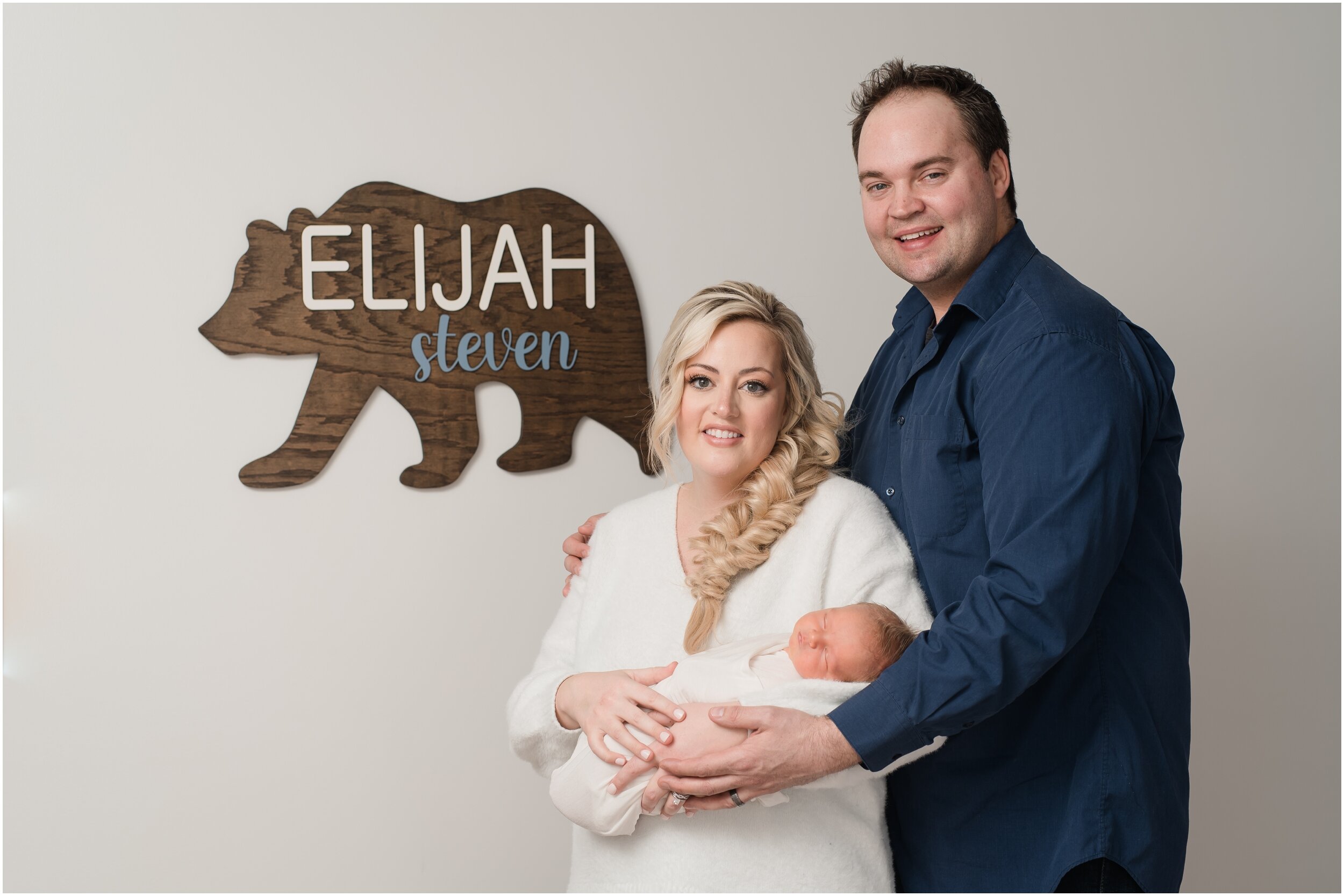 newborn family photo with bear