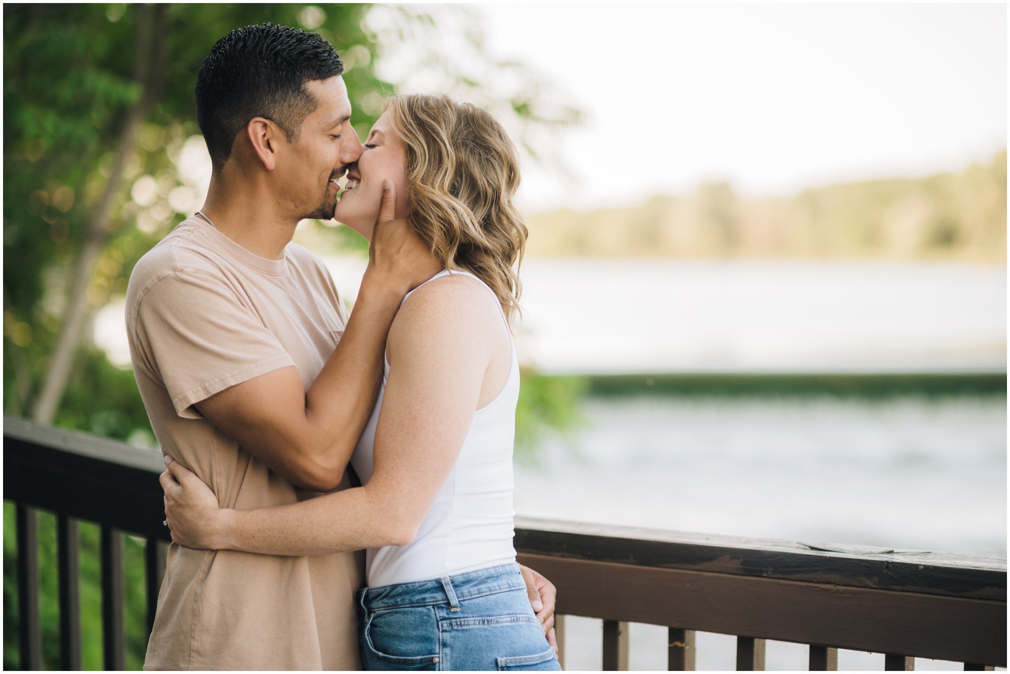 Engaged couple kissing