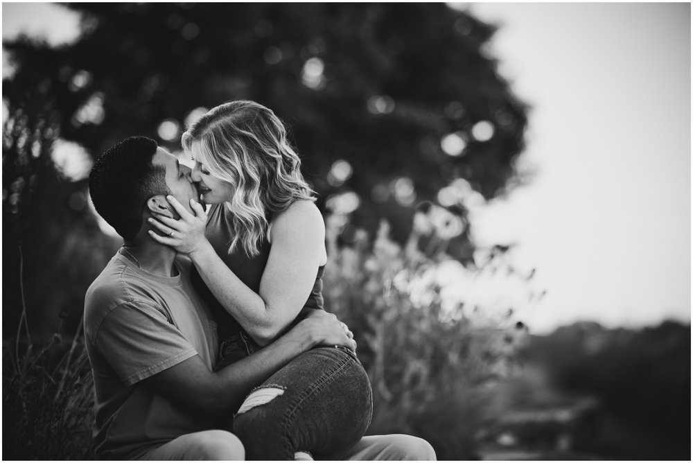 Kissing engaged couple