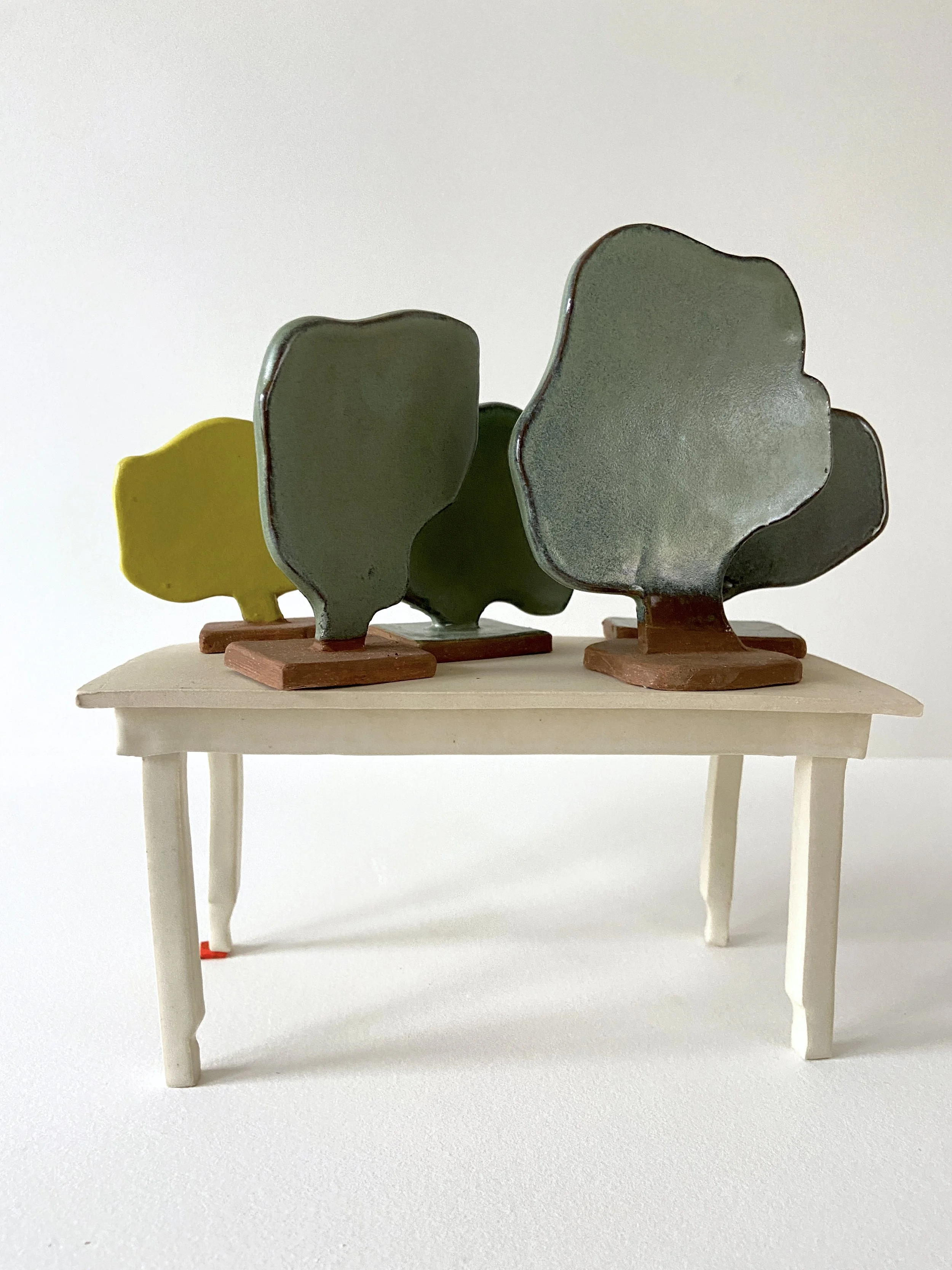  The Same (set of 5), 2022, glazed cone 6 ceramic stoneware, 4x7.25x3.5” set Shimmed Table, 2021, glazed cone 6 ceramic stoneware, 3.5x7.25x3.5” 