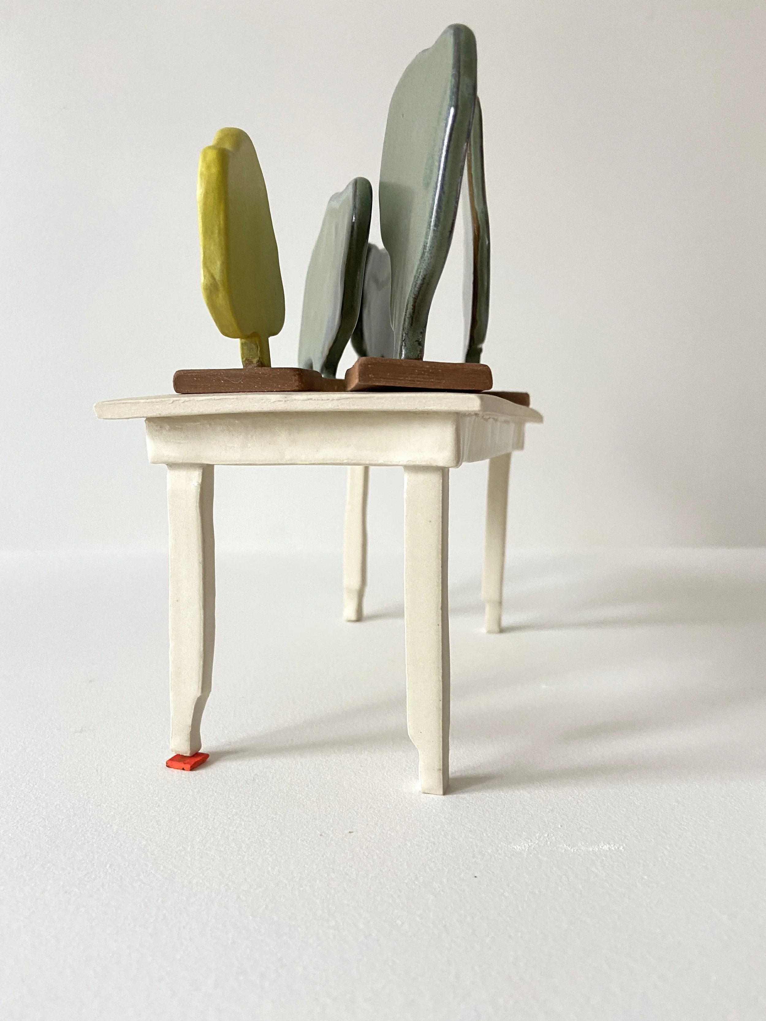   The Same (set of 5), 2022, glazed cone 6 ceramic stoneware, 4x7.25x3.5” set  Shimmed Table, 2021, glazed cone 6 ceramic stoneware, 3.5x7.25x3.5” 