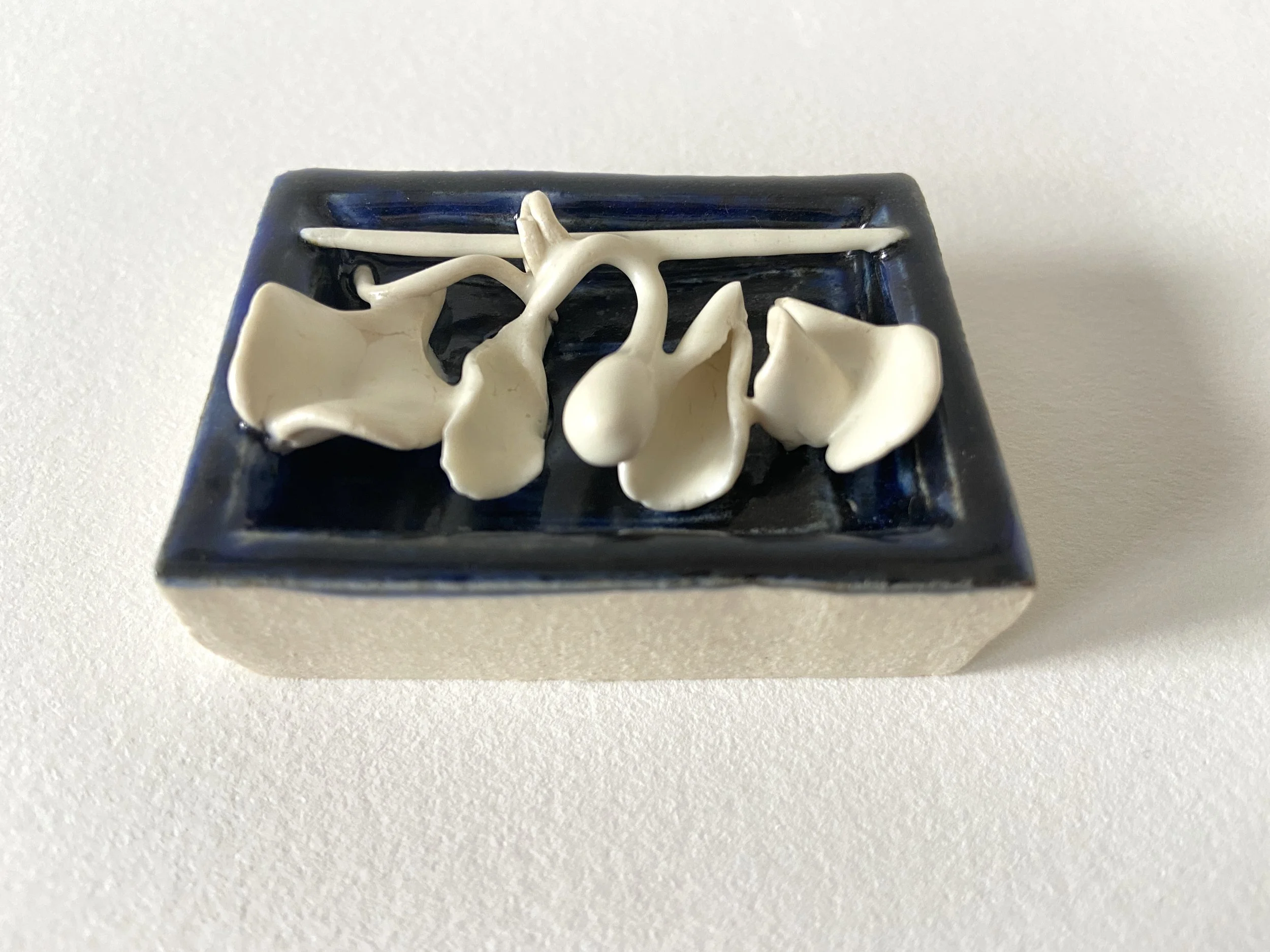  Garden, 2022, glazed cone 6 ceramic stoneware and porcelain, 1.75x3.25x0.5” 