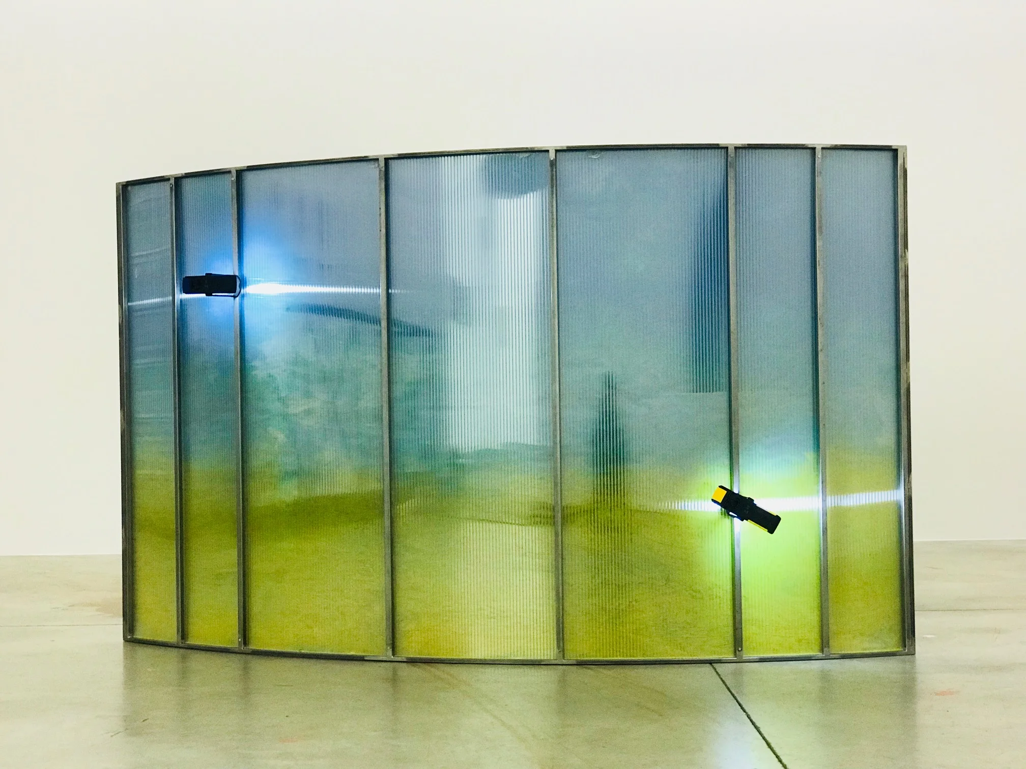 Julia Frank, untitled 55, 2018, iron, polycarbon, blue membrane, acrylic, body weight, gas and magnetic lamps, 123 x 213 x 28 cm