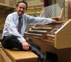 Maestro Radu at the console of the grand organ of the Bucharest Philharmonic Hall
