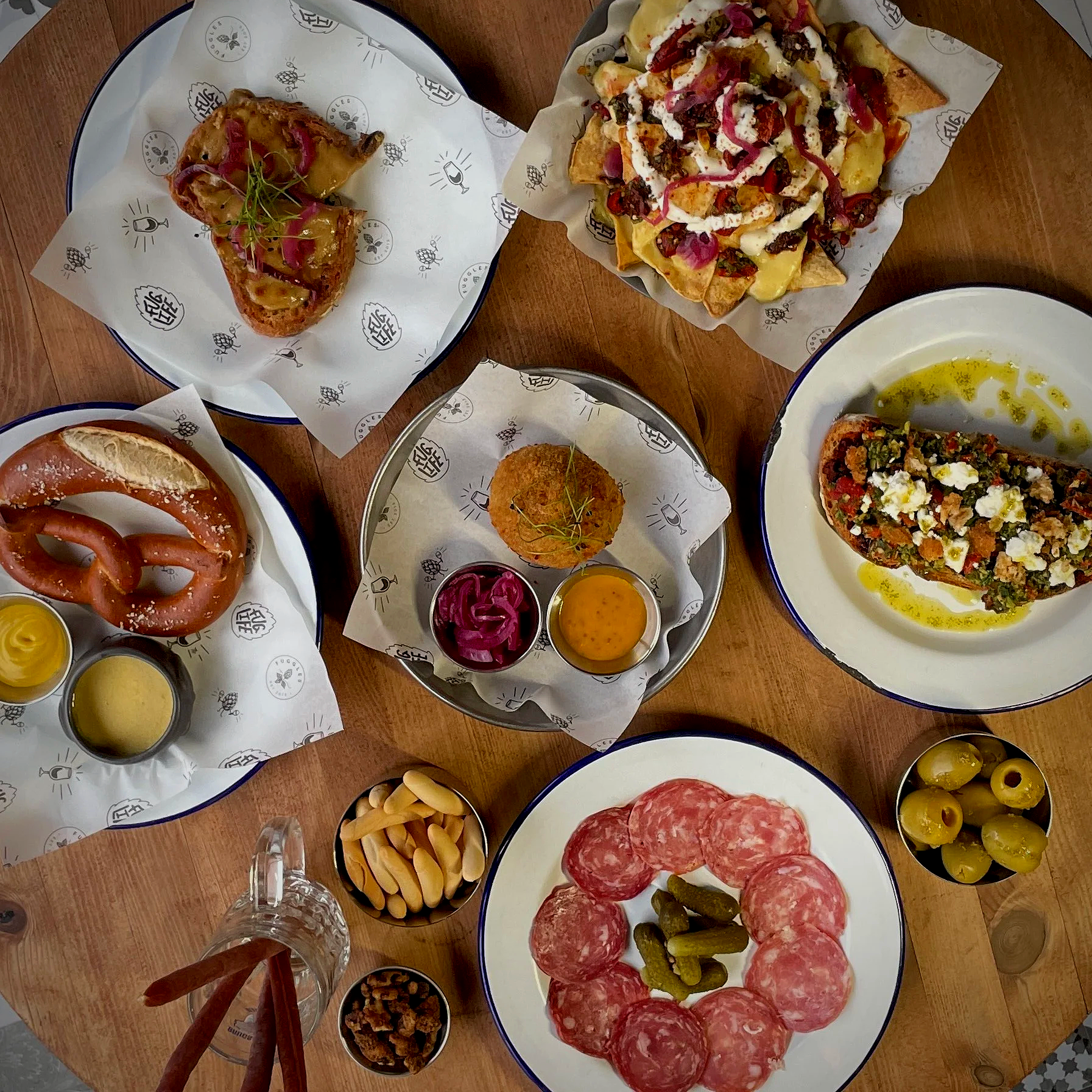A selection of food at Fuggles including a Scotch Egg, Nachoes, Pretzel and Sandwiches including Rarebit