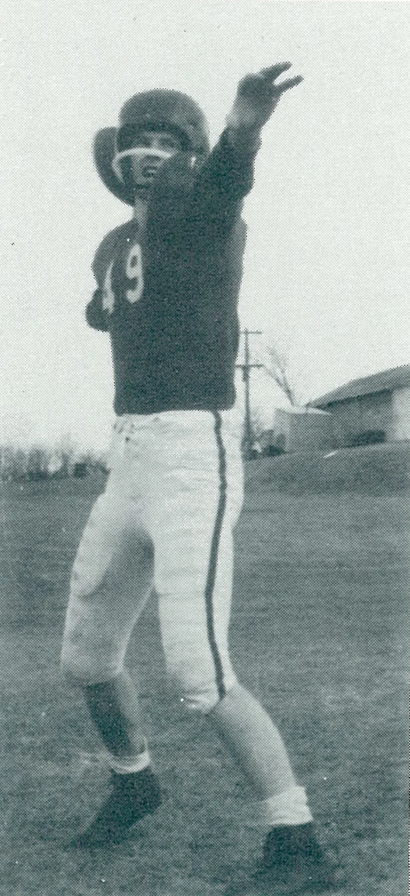 G.T. Gunhus poses in his football gear for a yearbook photo in 1957.
