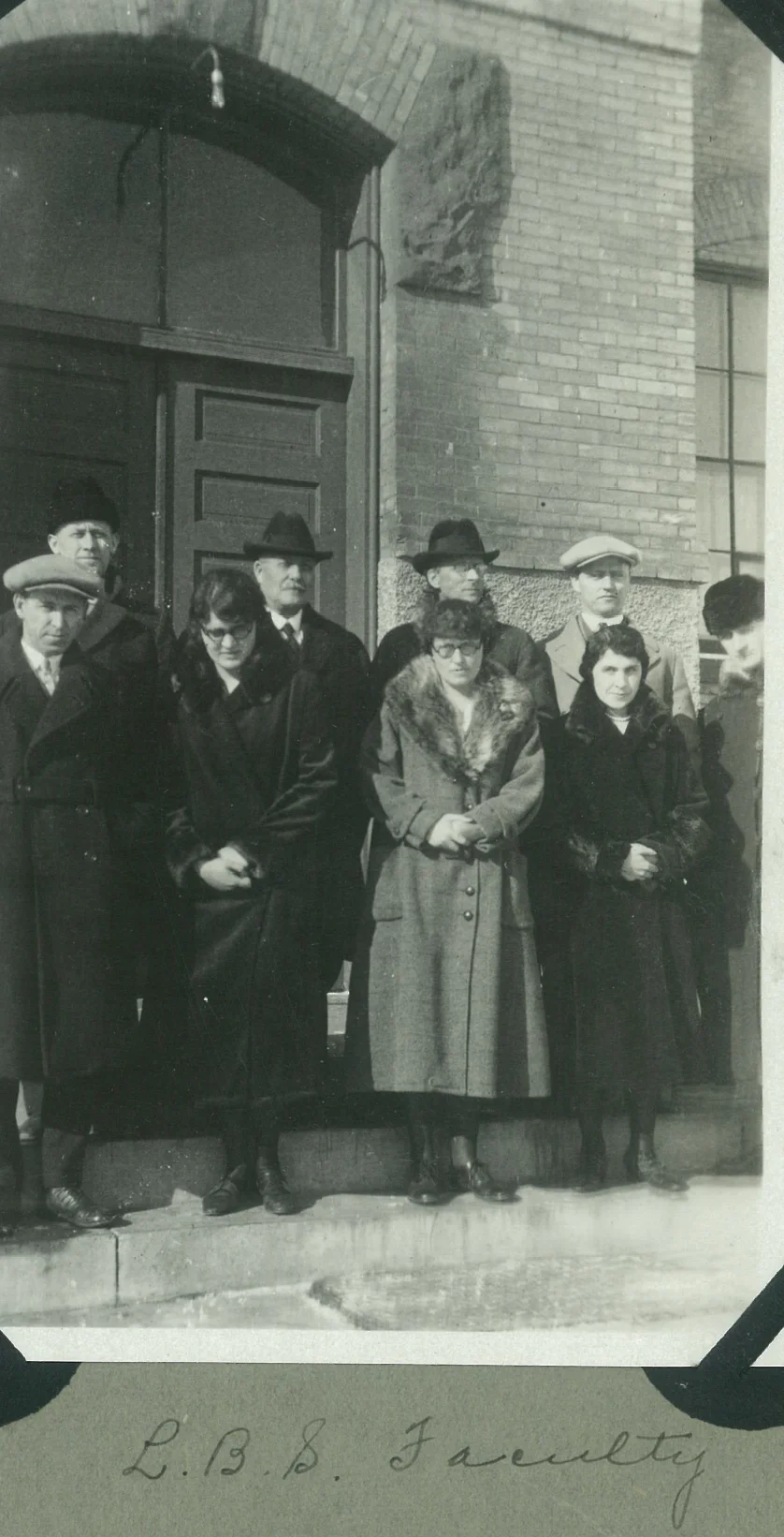 E.M. Broen, pictured with a handful of the Hillcrest and Bible School faculty, watched his staff carry his vision for Hillcrest Academy by going with no or reduced-pay for five years during some of Hillcrest's darkest times financially.