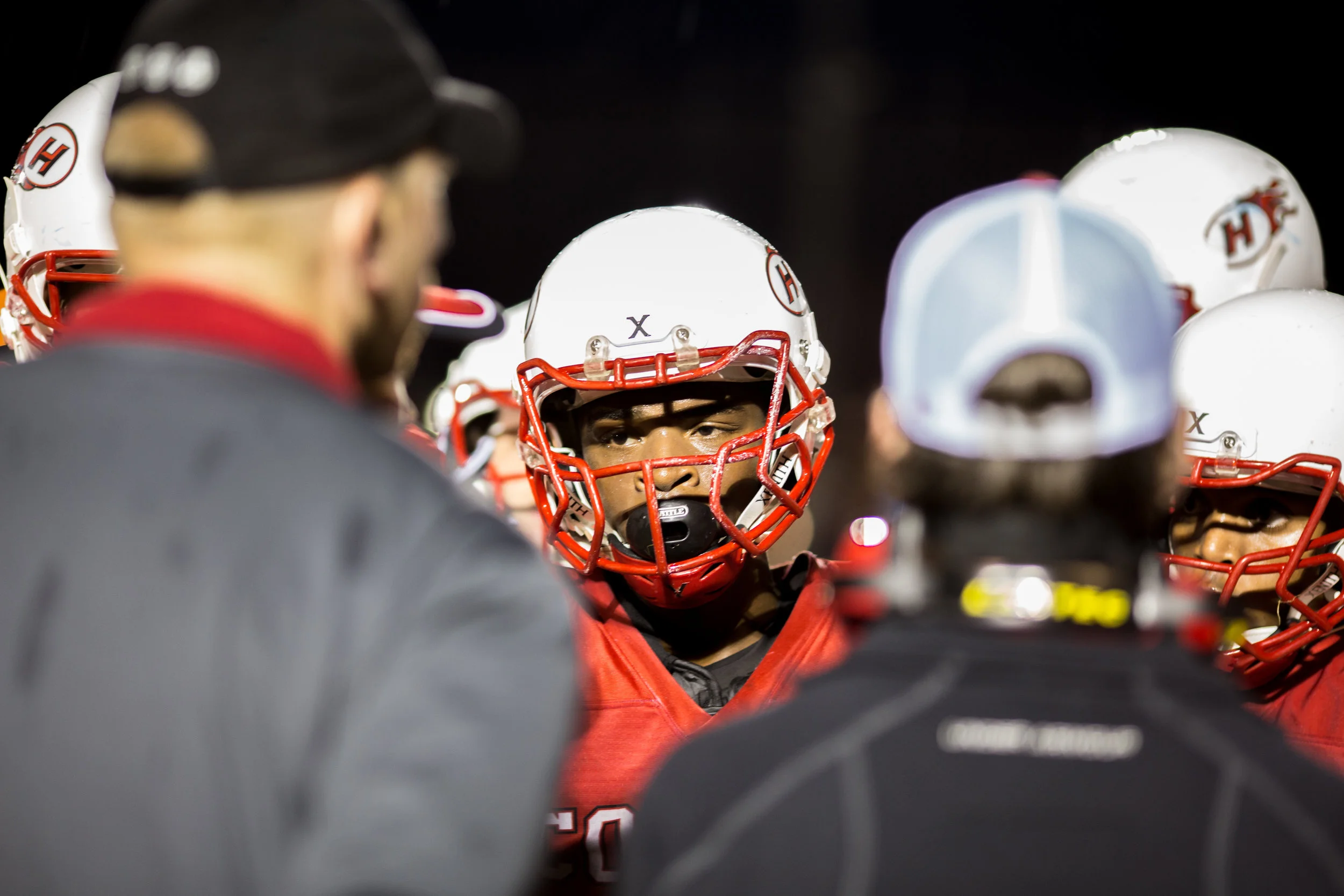 Senior running back Sam Ihrke looks in during a Hillcrest Huddle to correct blocking assignments that opened a scoring thunderstorm for the Comets.