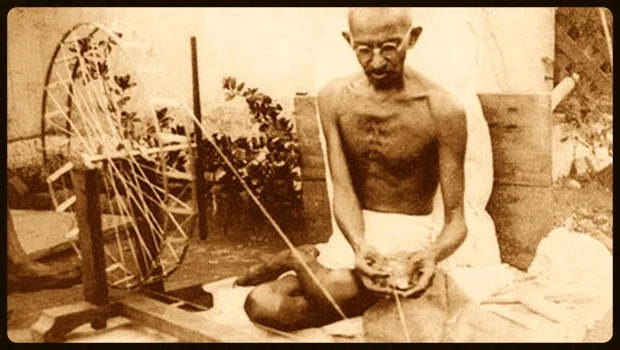 The foundation of Gandhi's vision was working towards peace with yourself through simple living and service to others. An early proponent of local economics and local self-sufficiency, pictured here with his spinning wheel. 