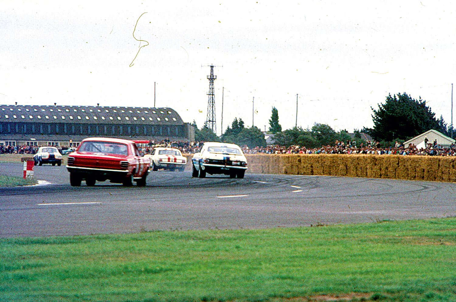 Clyde Collins in the PDL Falcon chases Grady Thomson in the Cambridge Monaro in 1970