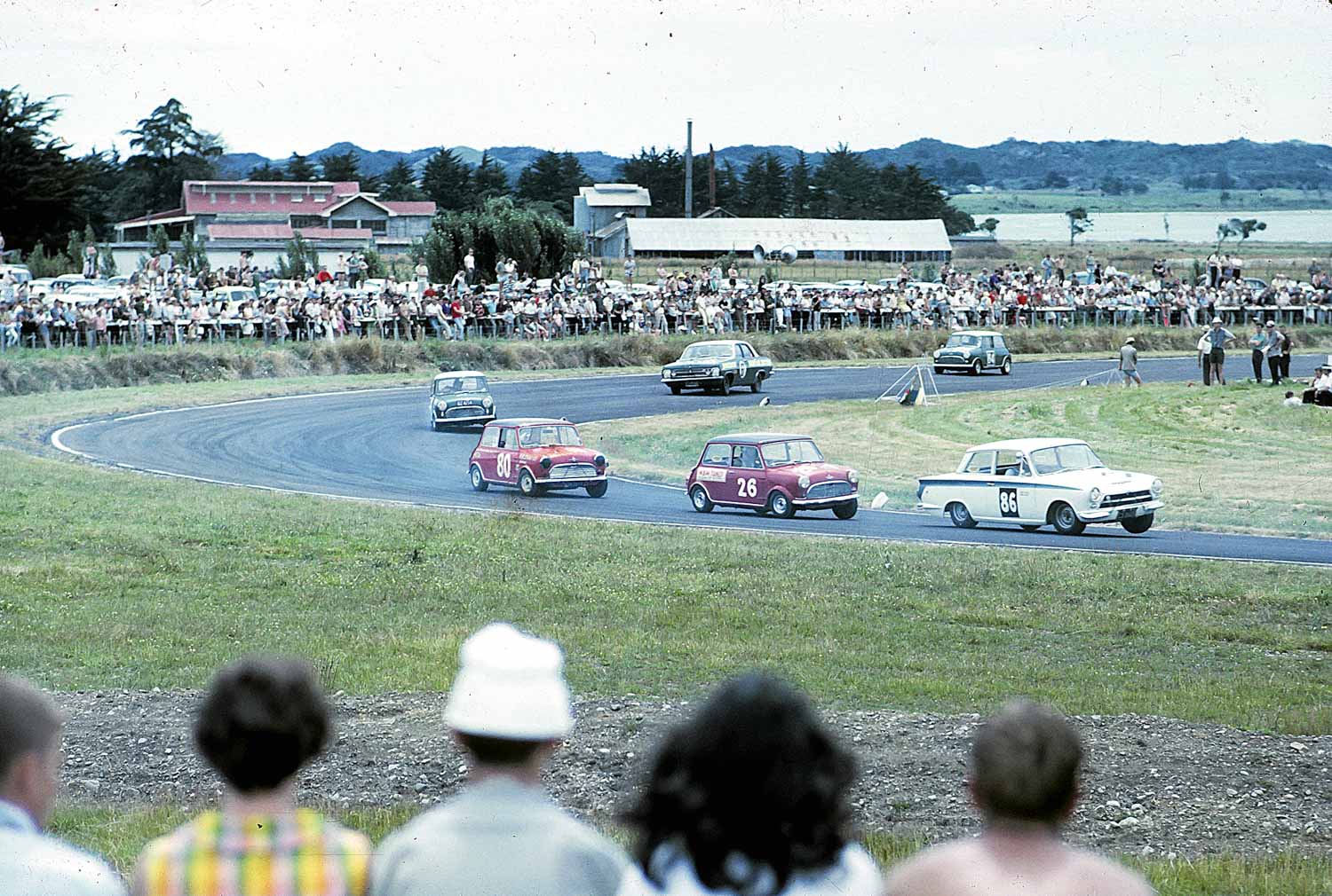 A Cortina leads a gaggle of Minis and an HR Holden