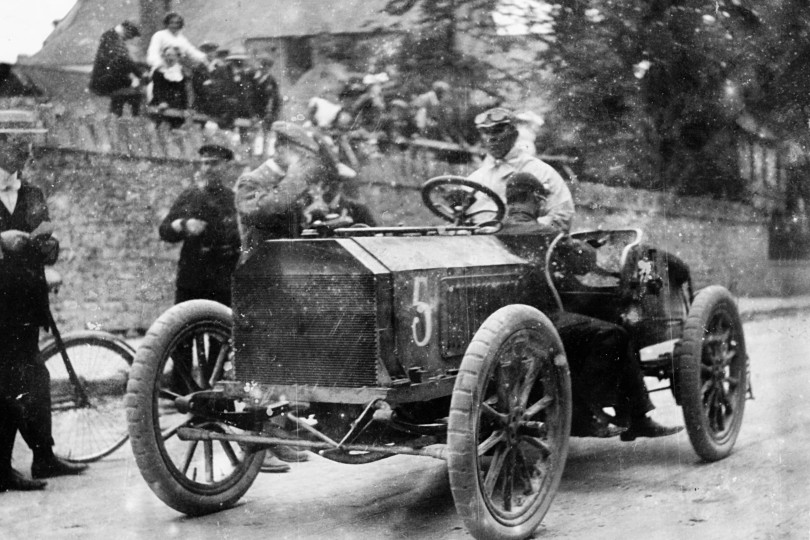 Motor racing pioneer S F Edge at the wheel of a Napier