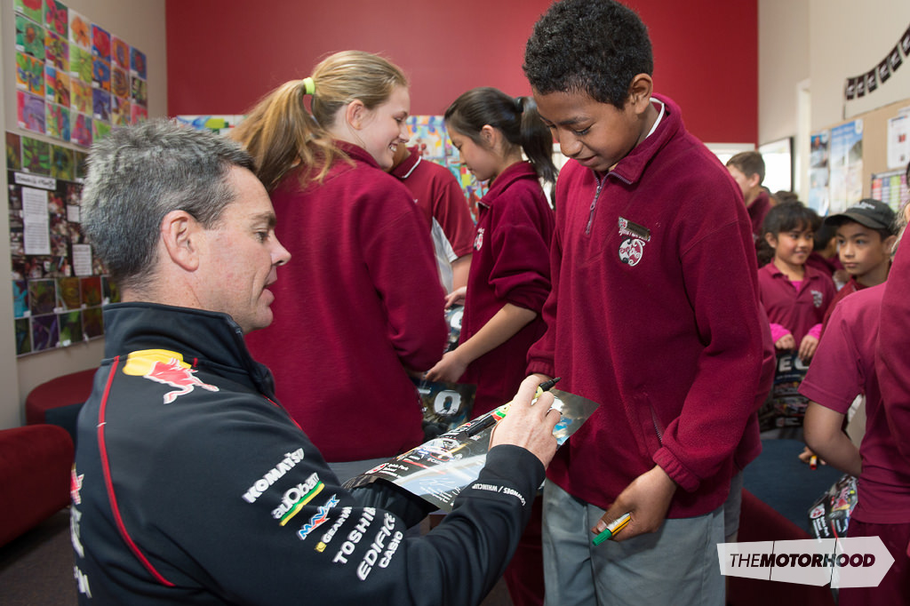 Pulupoi Kaufusi takes the rare opportunity to get Craig Lowndes’ autograph