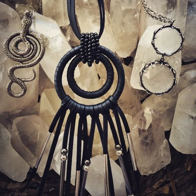 Shown here: Serpent Amulet, Chow Wheel Amulet, and the Freya Quartz Necklace.