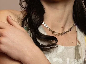 GEZNO magazine model wears collar necklace 18k gold champagne diamonds and silver 925
