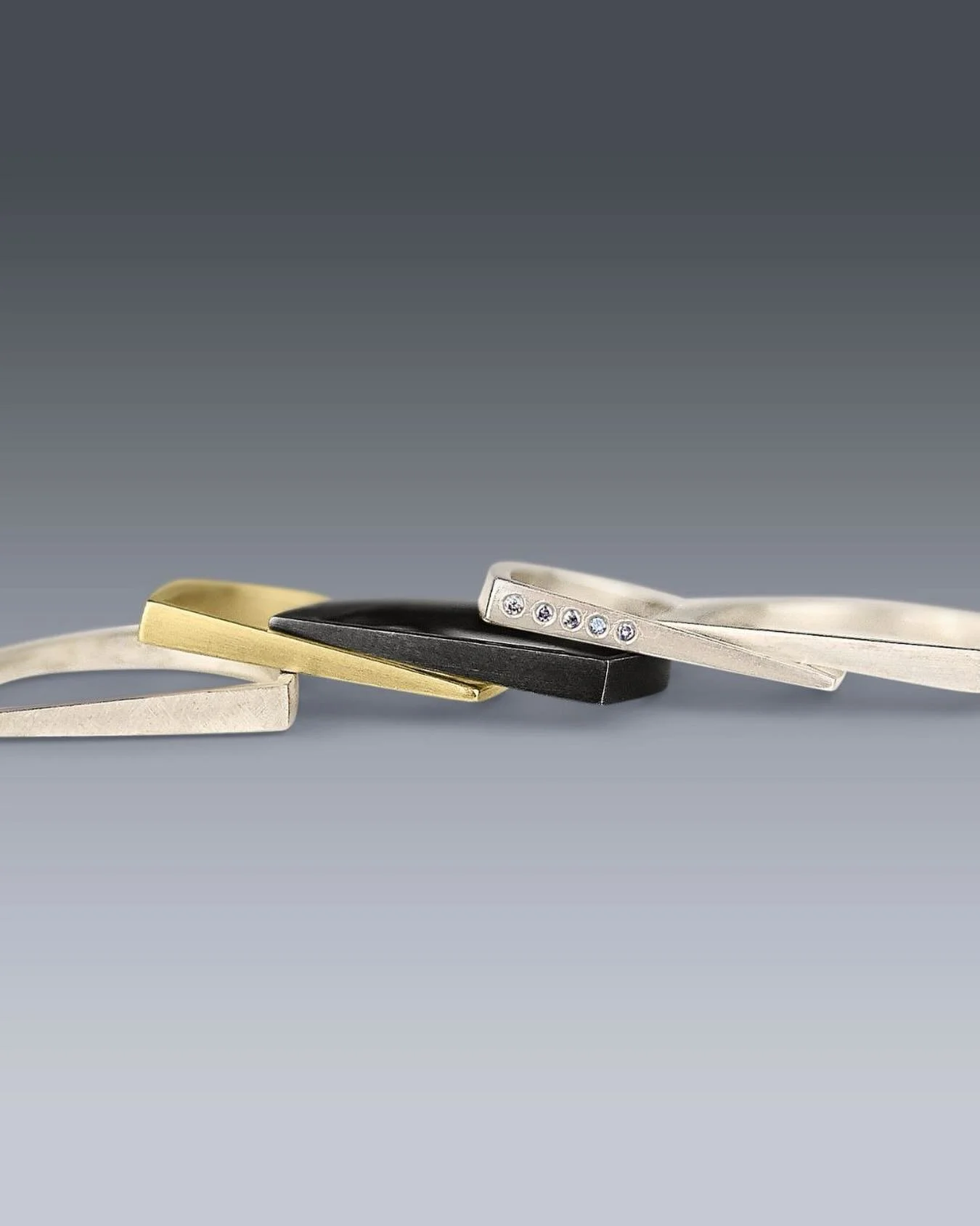 So many choices too little time. Just stack them all. 
Salt N Pepper Diamonds
18k Gold
Patinated Sterling Silver
Brushed Sterling Silver 
Textured Sterling Silver 
.
.
.

#artjewelry #contemporaryjewelry #artisanjewelry #studiojewelry geometricjewelr