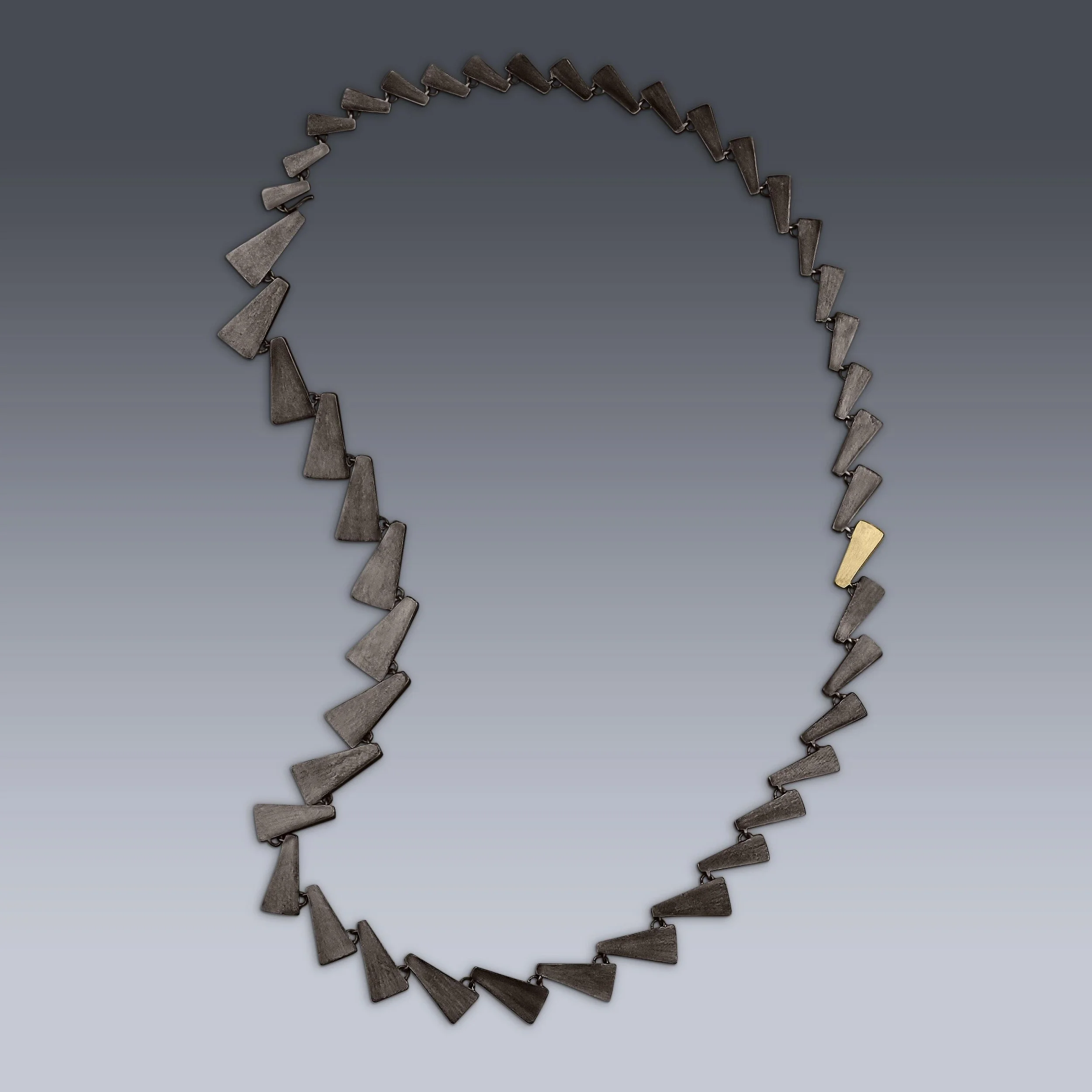 Ophiusa Necklace 

Features a triangular shaped geometric 3 dimensional form. 

Patinated Sterling Silver with a one 18k gold link. 
.
.
.
#geometricjewelry #ooak #contemporaryartjewelry #sculpturetowear #studiojewelry