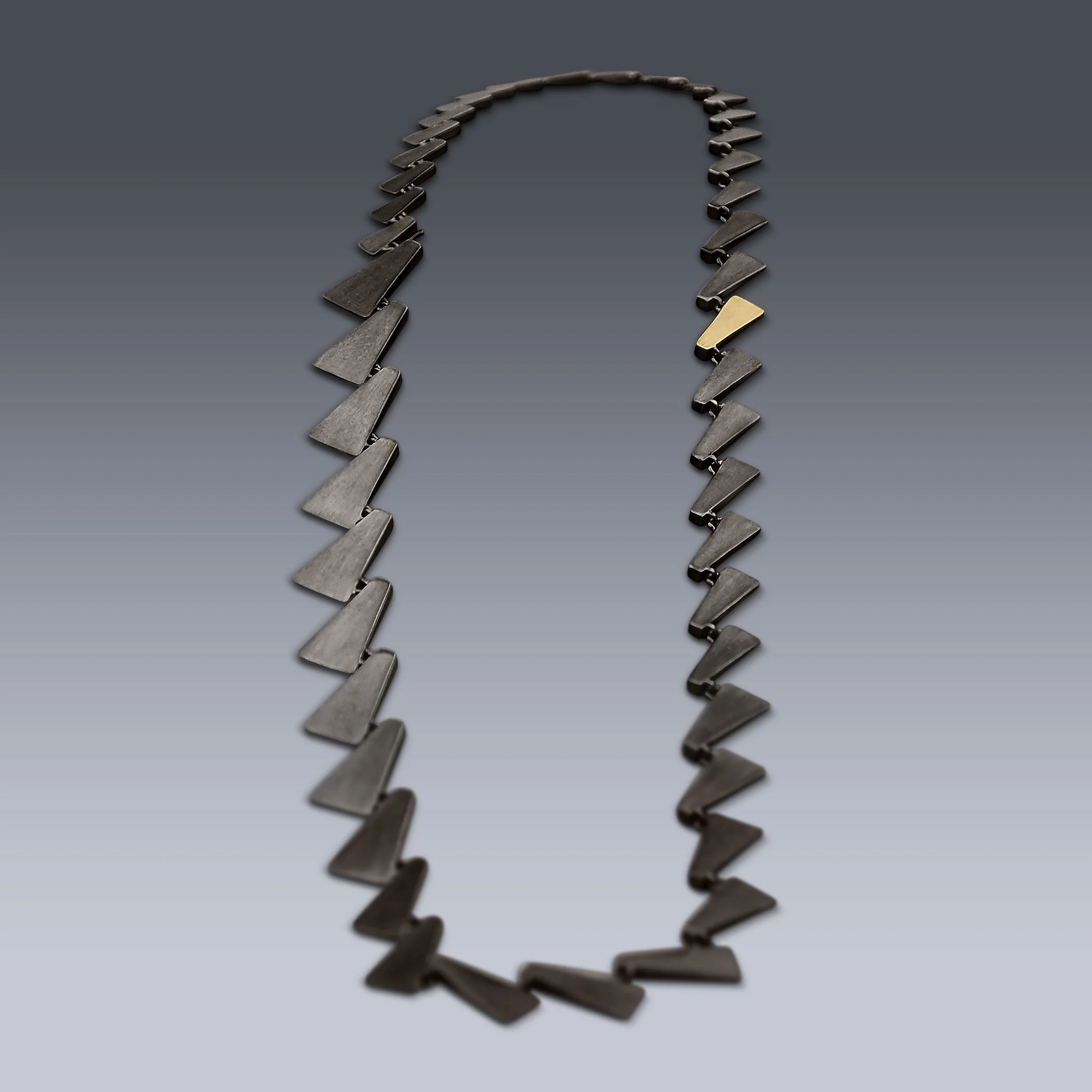 Ophiusa Necklace

Designed with a seamless hidden clasp, this necklace offers multiple distinct looks in one. Wear it with the bold, large links in the front for a statement, or rotate it to showcase the delicate, smaller links.  Or even somewhere in