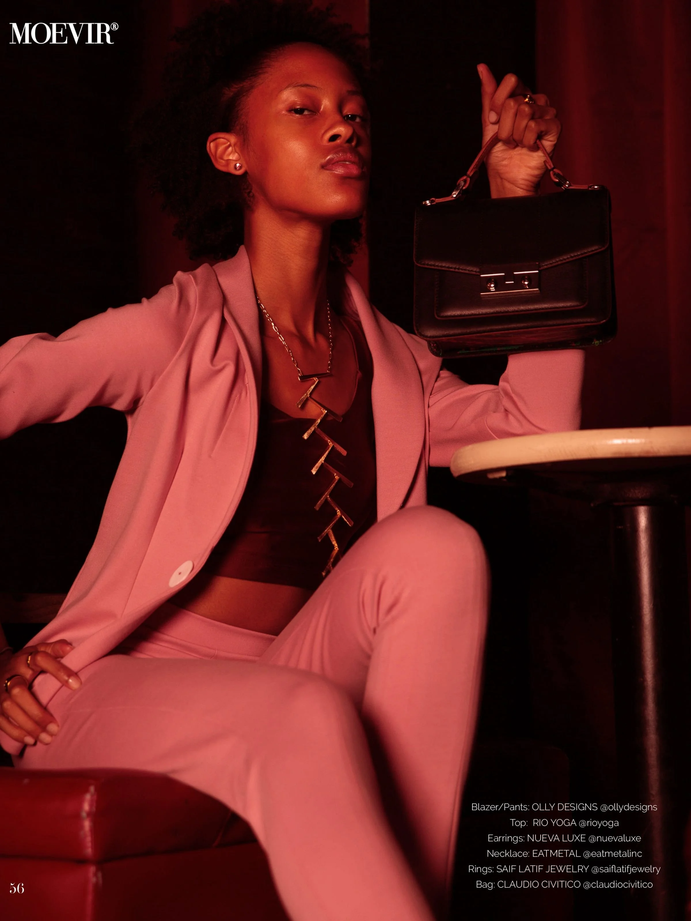 Moevir model wears Eatmetal Ladder of Life necklace 22 karat gold overlay with lapis lazuli