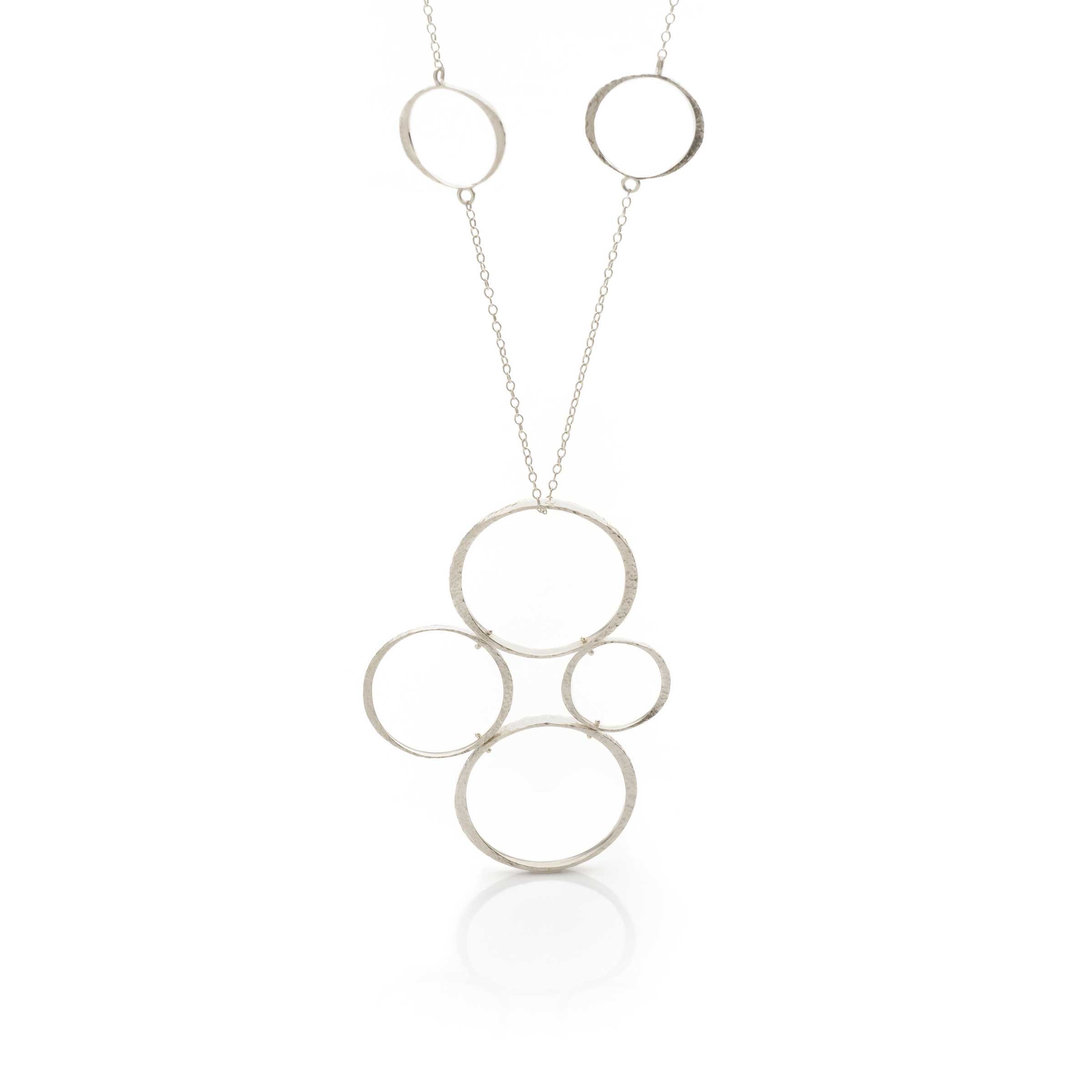 Bright high-polish sterling silver Tetrad Circle statement necklace handcrafted by EatMetal in Hoboken NJ.