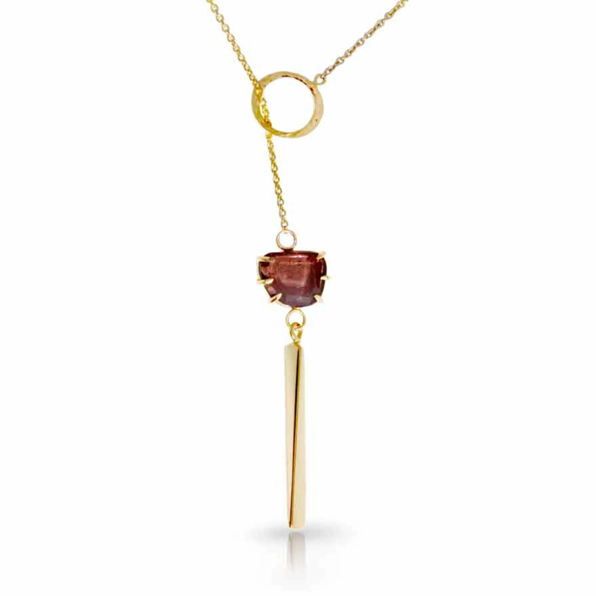 Close-up detail of 14k gold wire connections linking a rose-cut red tourmaline gemstone to a slender hand-forged gold bar