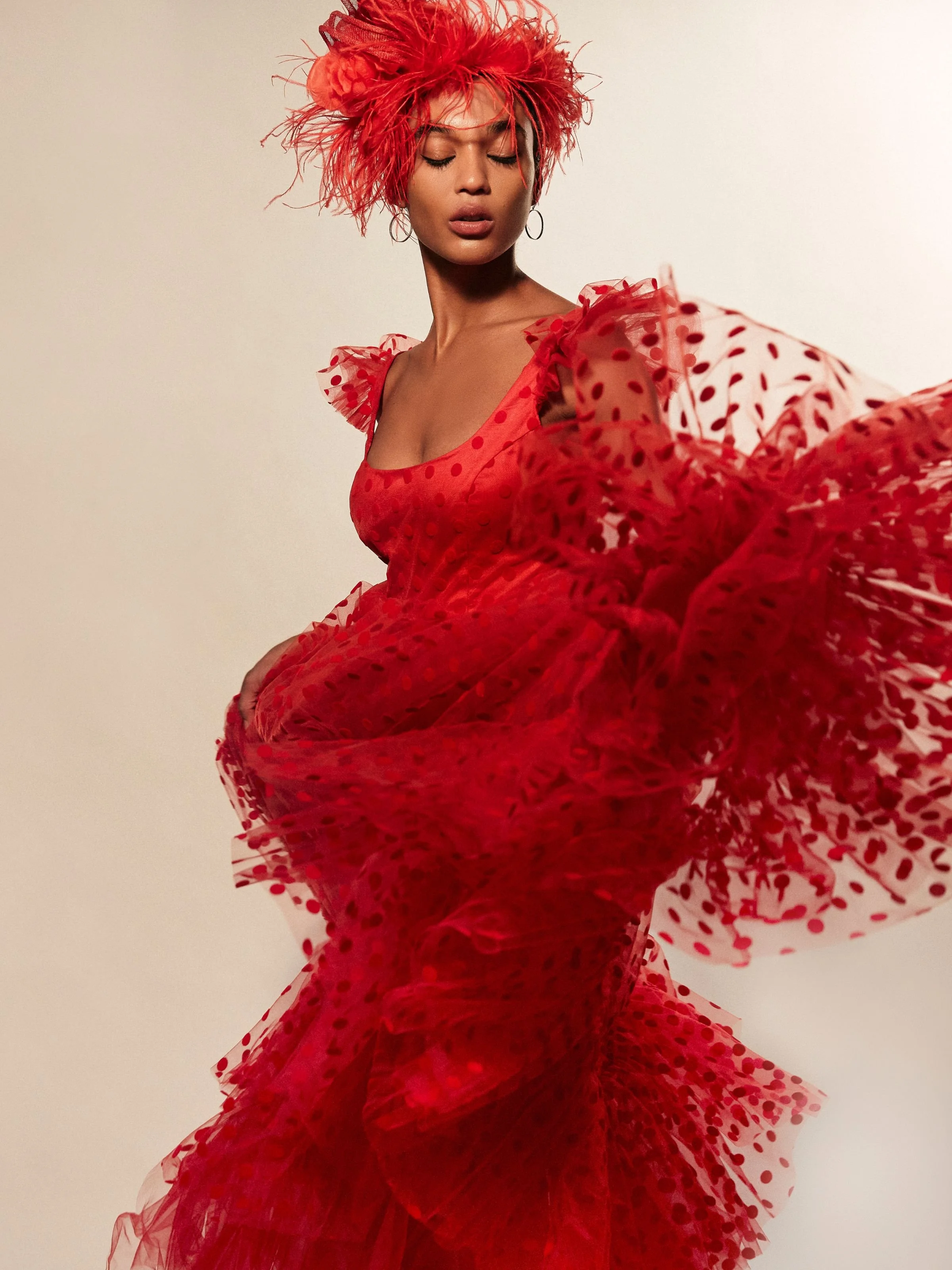 Mini Solitaire Circlet earrings Sterling Silver shown on a model from Harper's Bazaar photoshoot wearing a red polkadot dress