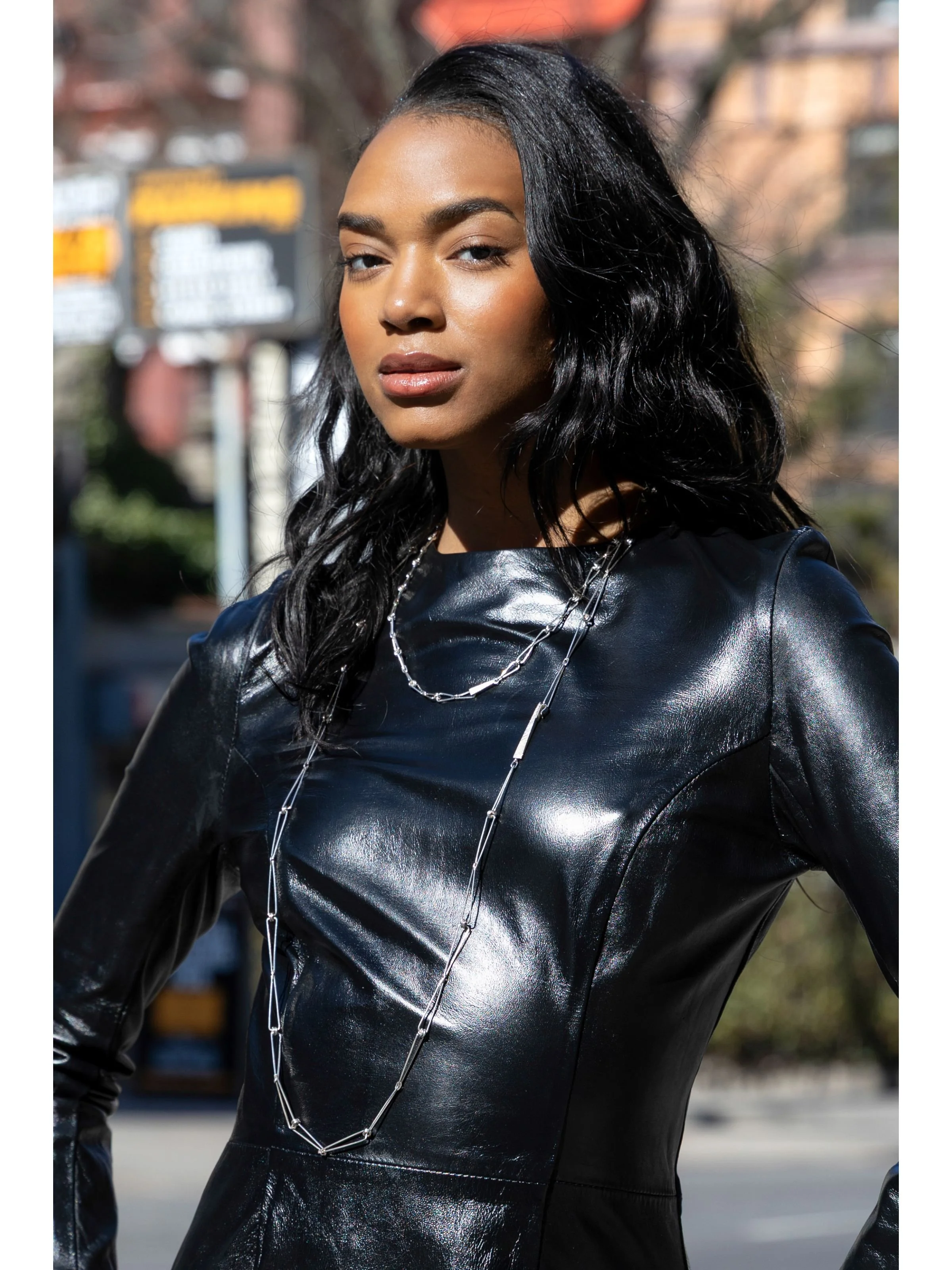 Flanelle model wears Eatmetal necklace Acute Isosceles Chain Large and Medium Sterling Silver