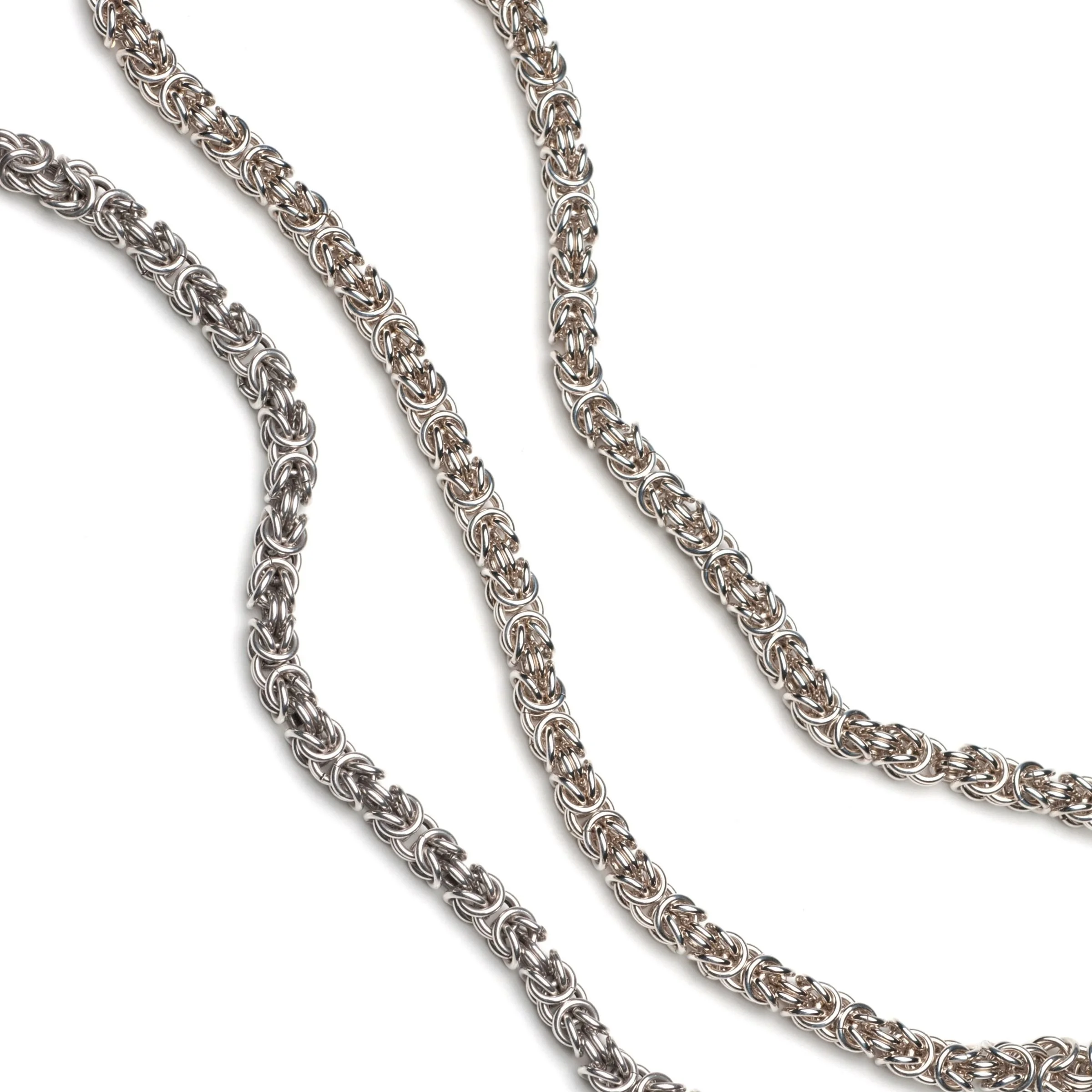 chainmail_silver_gold_pattern_detail_on_white_background
