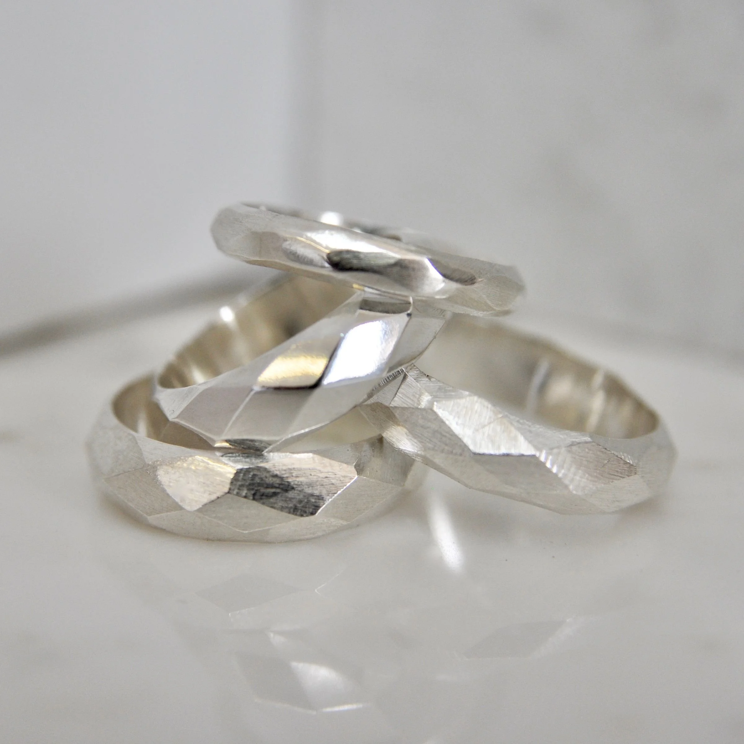 Handcrafted silver rings created during a studio jewelry bench rental session