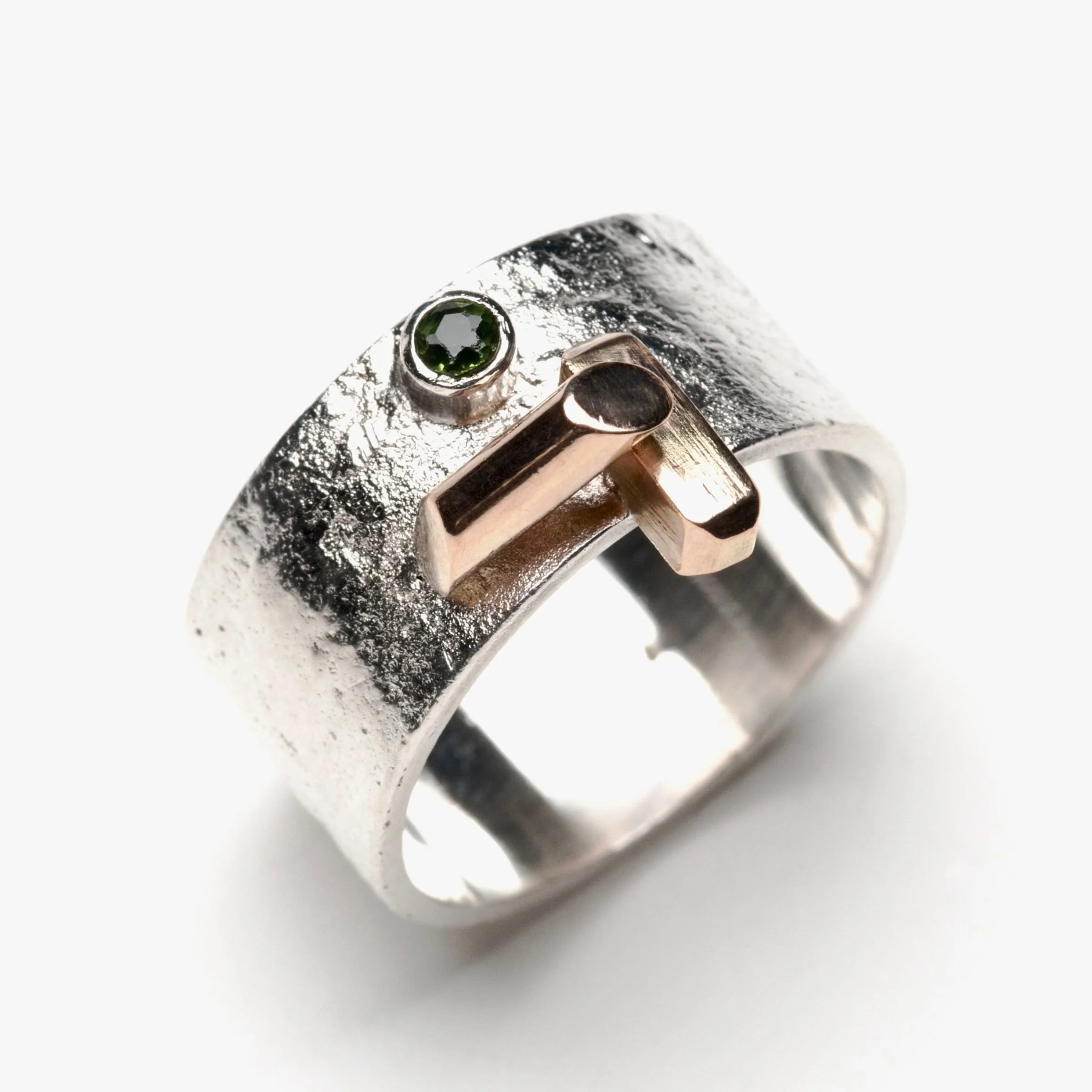Heirloom Redesign wide, textured sterling silver band ring featuring an organic reticulated surface, an abstract geometric 18k gold T-shaped accent, and a small bezel-set round green tourmaline.