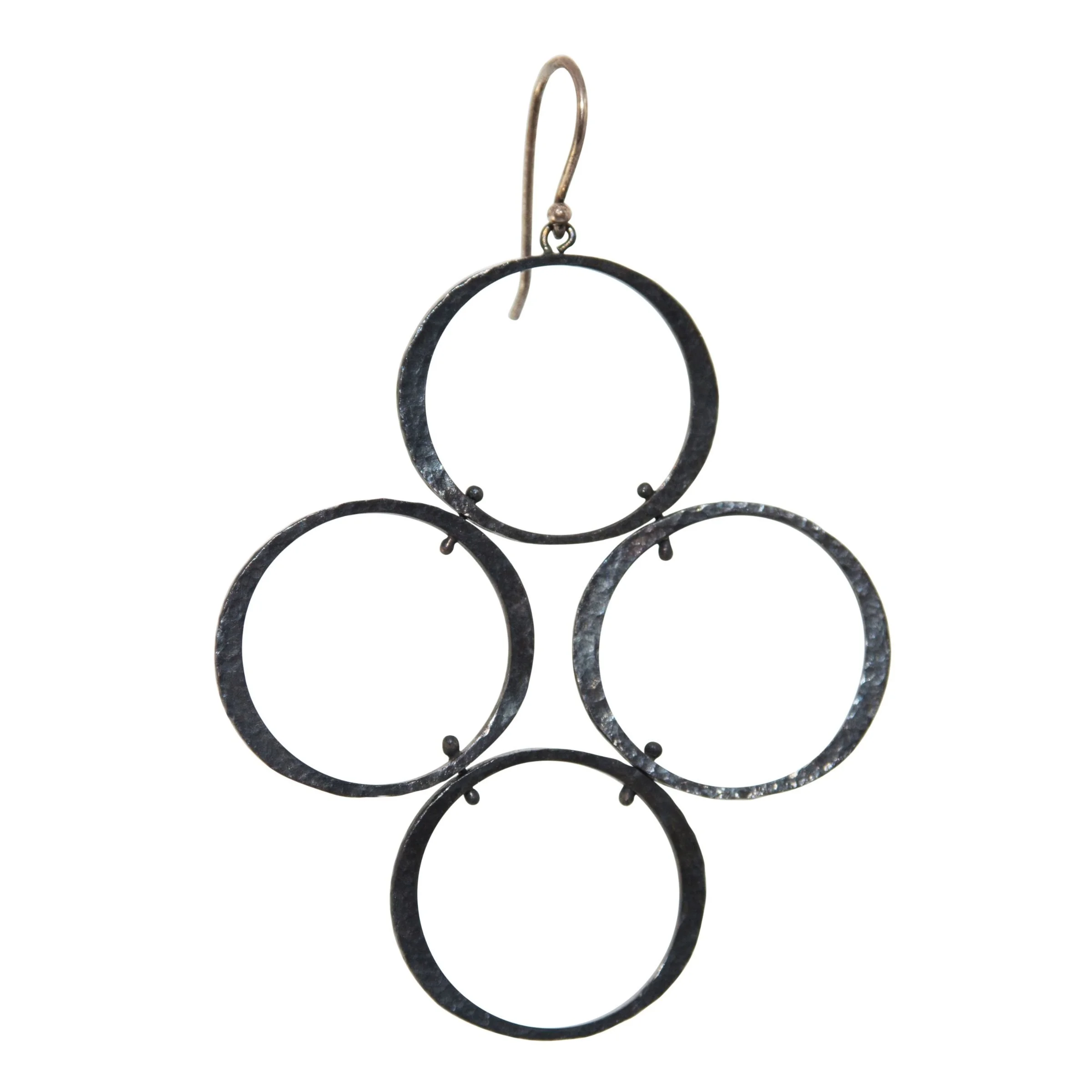 Close-up detail of 18k gold balled wire connections on patinated sterling silver circle drop earrings