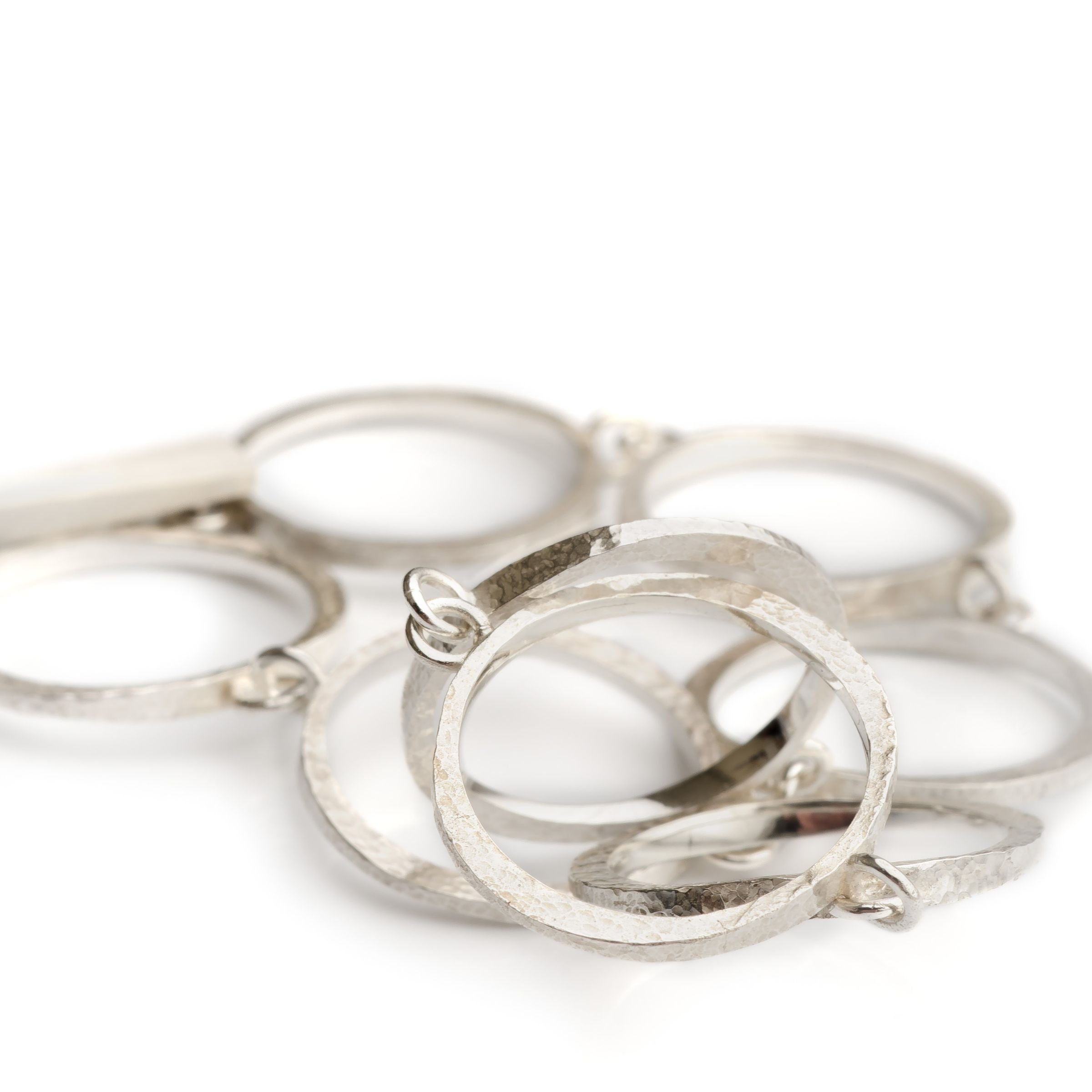 sterling silver and patinated circle link bracelets with hammer-textured finish