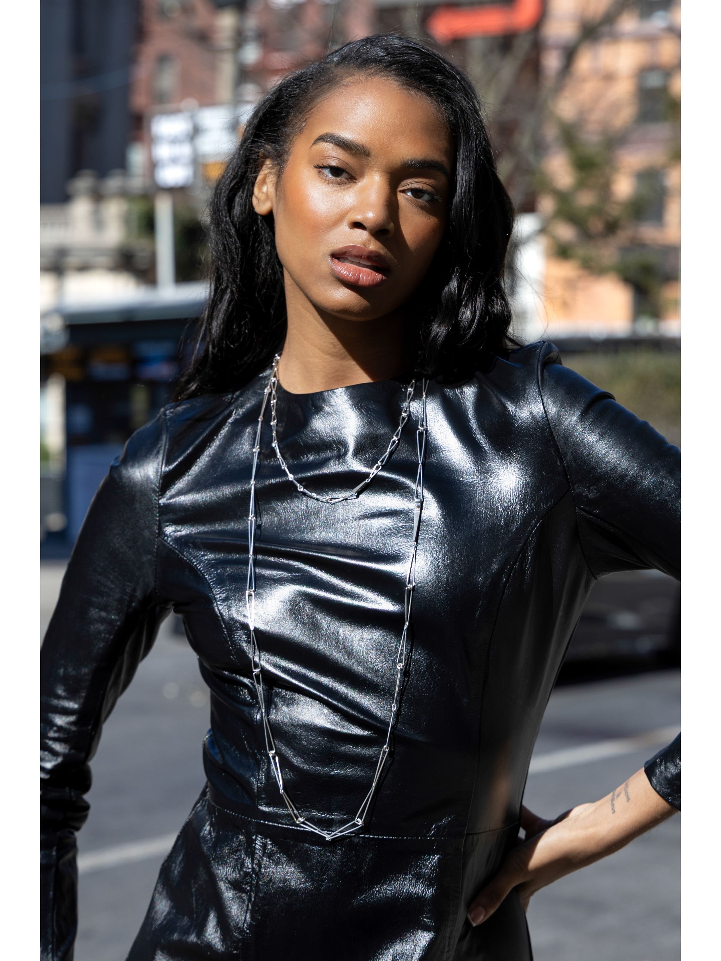 Flanelle model wears Eatmetal necklace Acute Isosceles Chain Large and Medium Sterling Silver