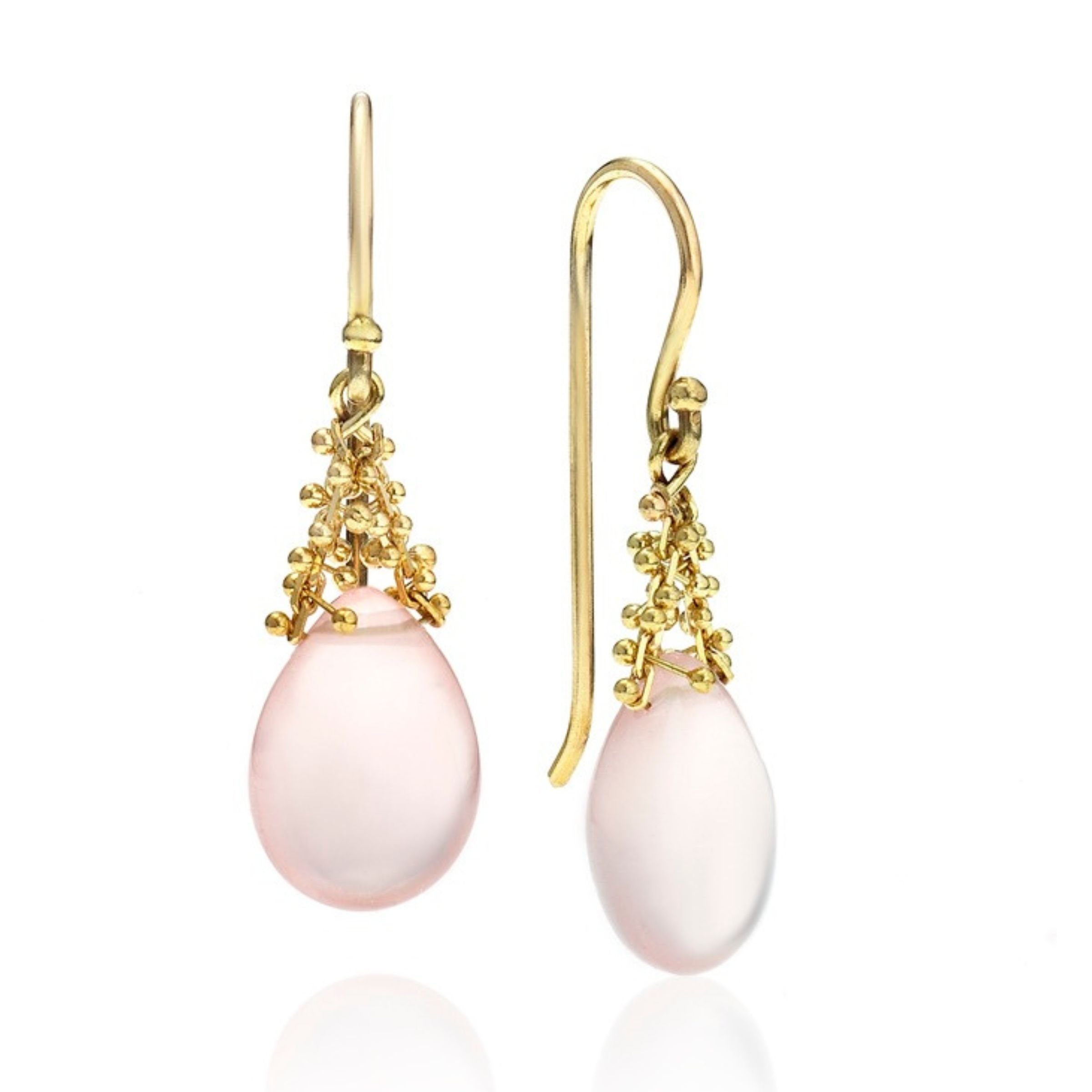 Modern 14k and 18k yellow gold dangle earrings featuring pastel pink quartz teardrop cabochons under a detailed, textured 18k gold bead cap with elegant curved hook backings