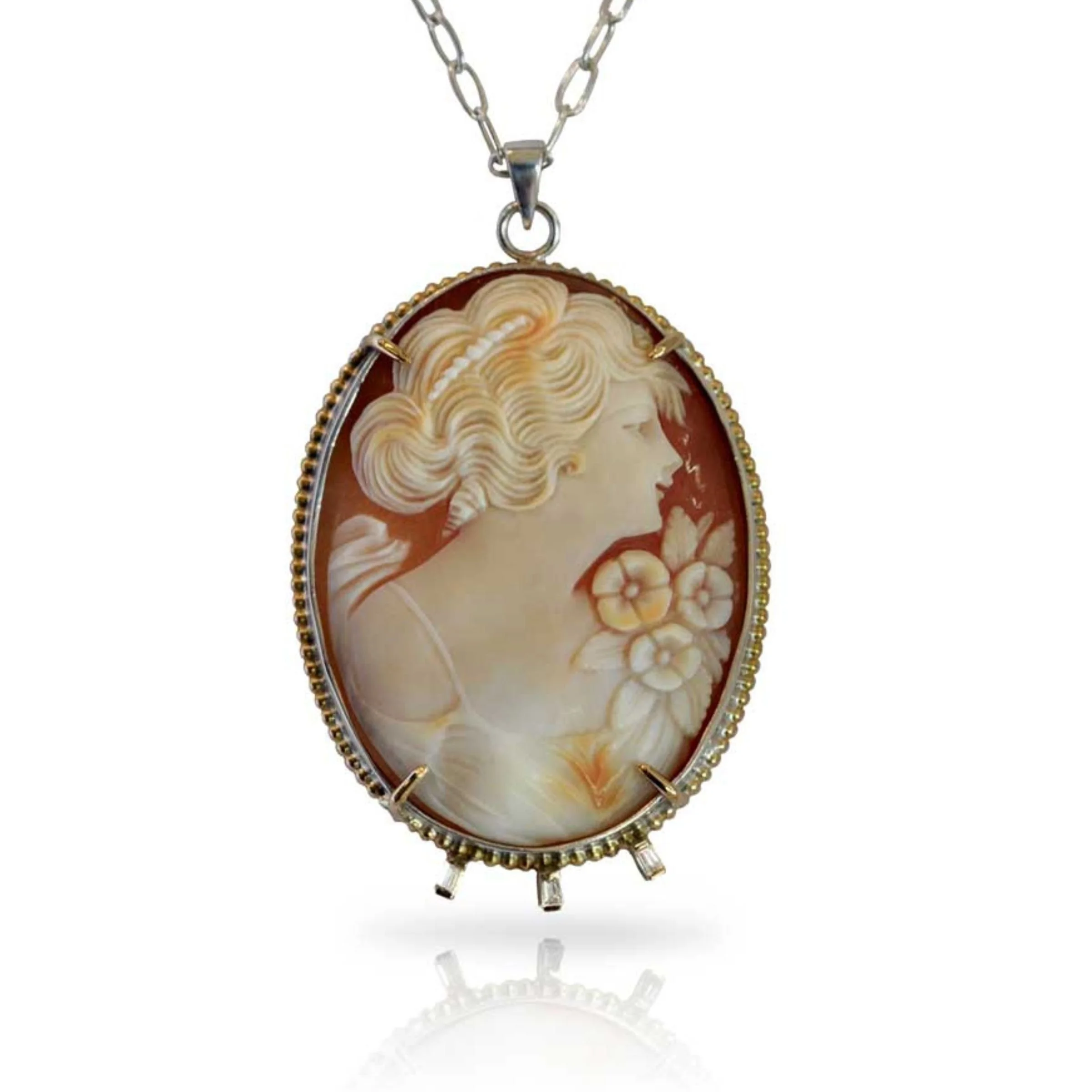 Heirloom Redesign Hand-carved carnelian shell cameo necklace showing a classical female portrait bust with floral details, mounted in a 14k gold  filigree border prong setting. Hanging on a paperclip chain sterling silver necklace