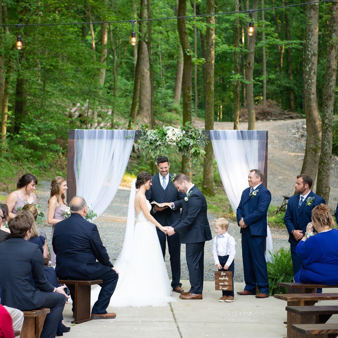 A beautiful outdoor ceremony! Caytlin &amp; Chase said &quot;I do&quot; surrounded by trees and loved ones 🥰⁠