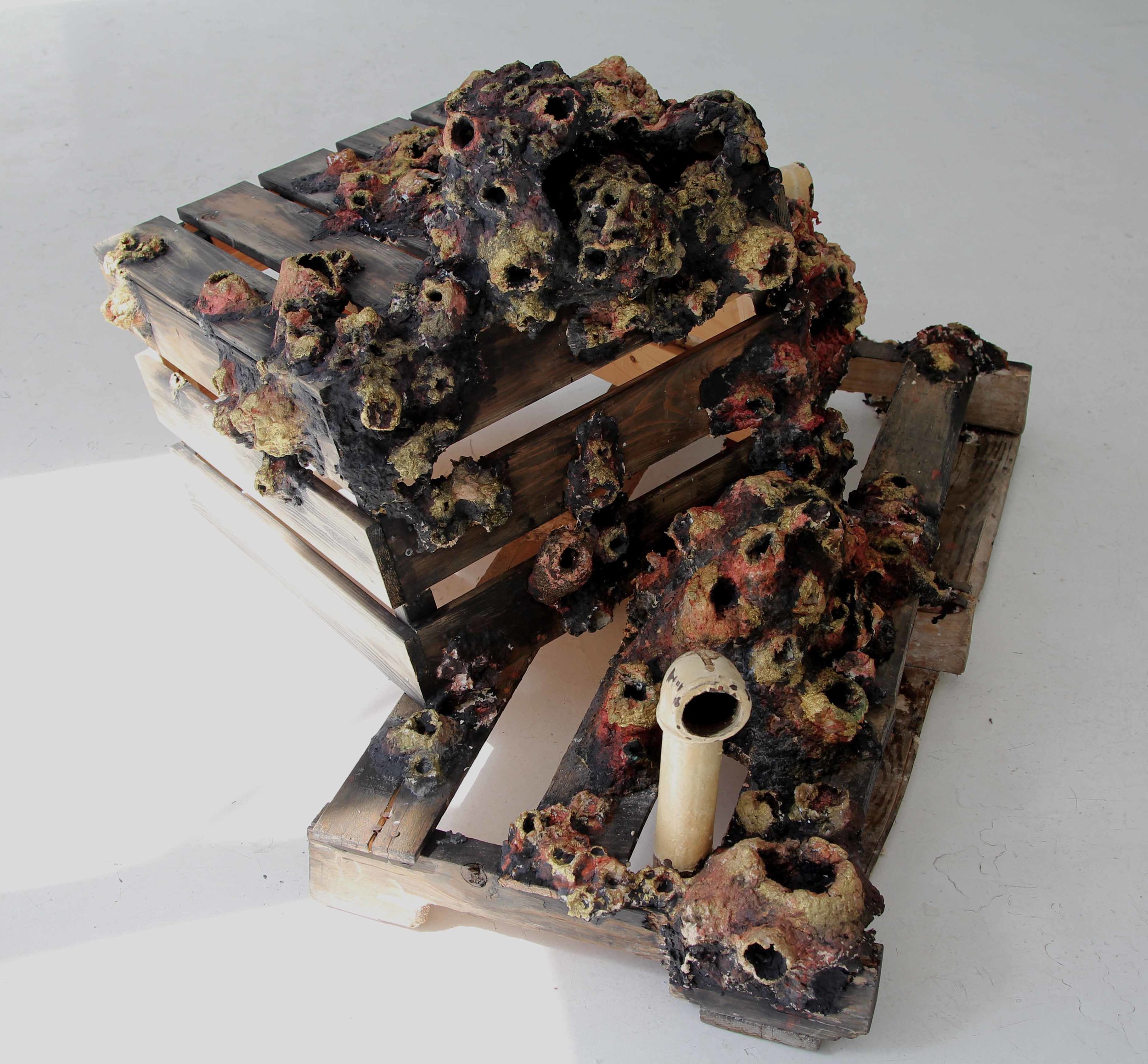 Ta barnacle. Sculptural installation in situ , Galerie Yellow Fish, Montreal. Handmade recycled paper sculpture with paint and ink, wooden crates, antique plumbing pipes. 
