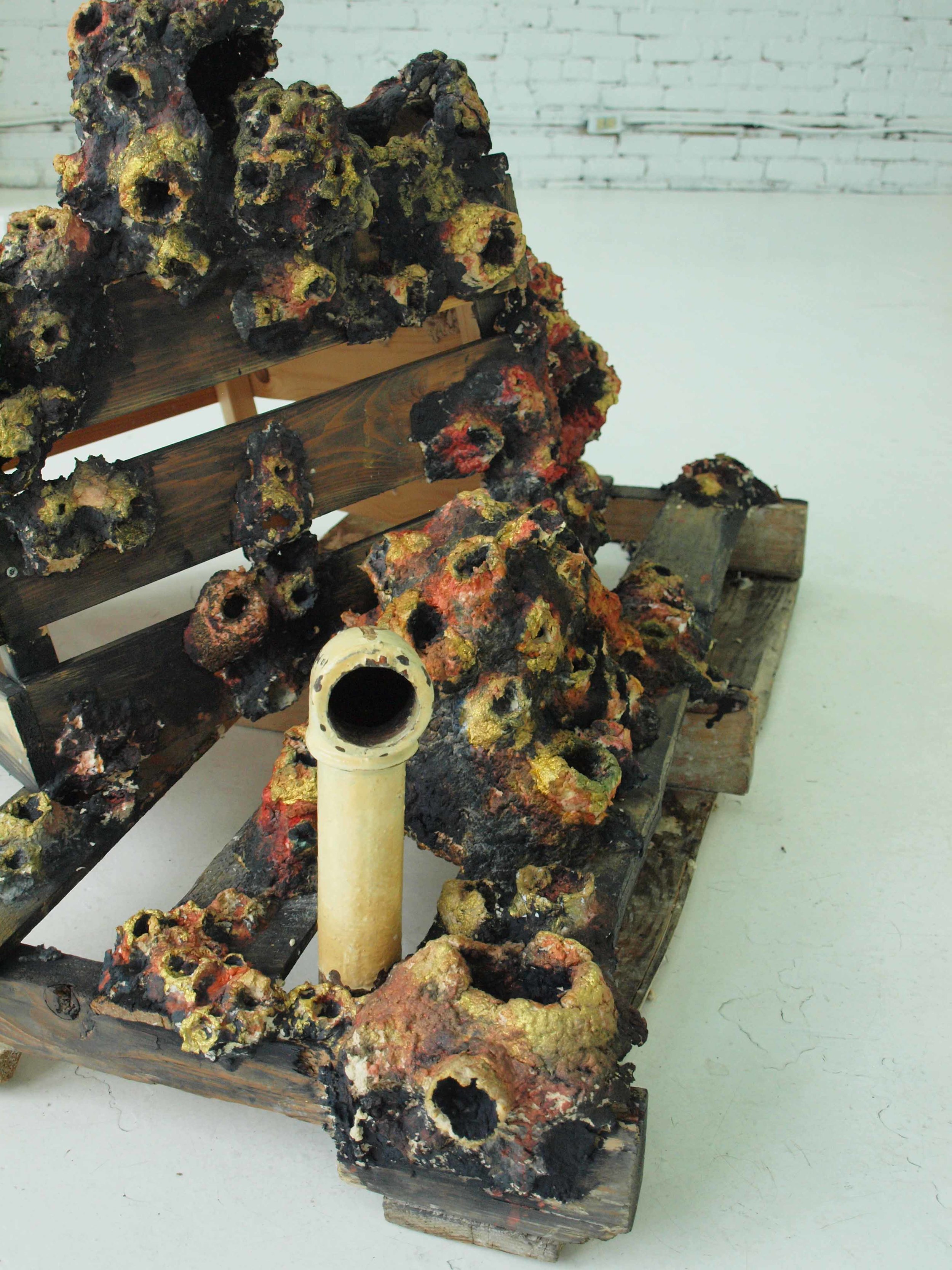 Ta barnacle. Sculptural installation in situ , Galerie Yellow Fish, Montreal. Handmade recycled paper sculpture with paint and ink, wooden crates, antique plumbing pipes. 