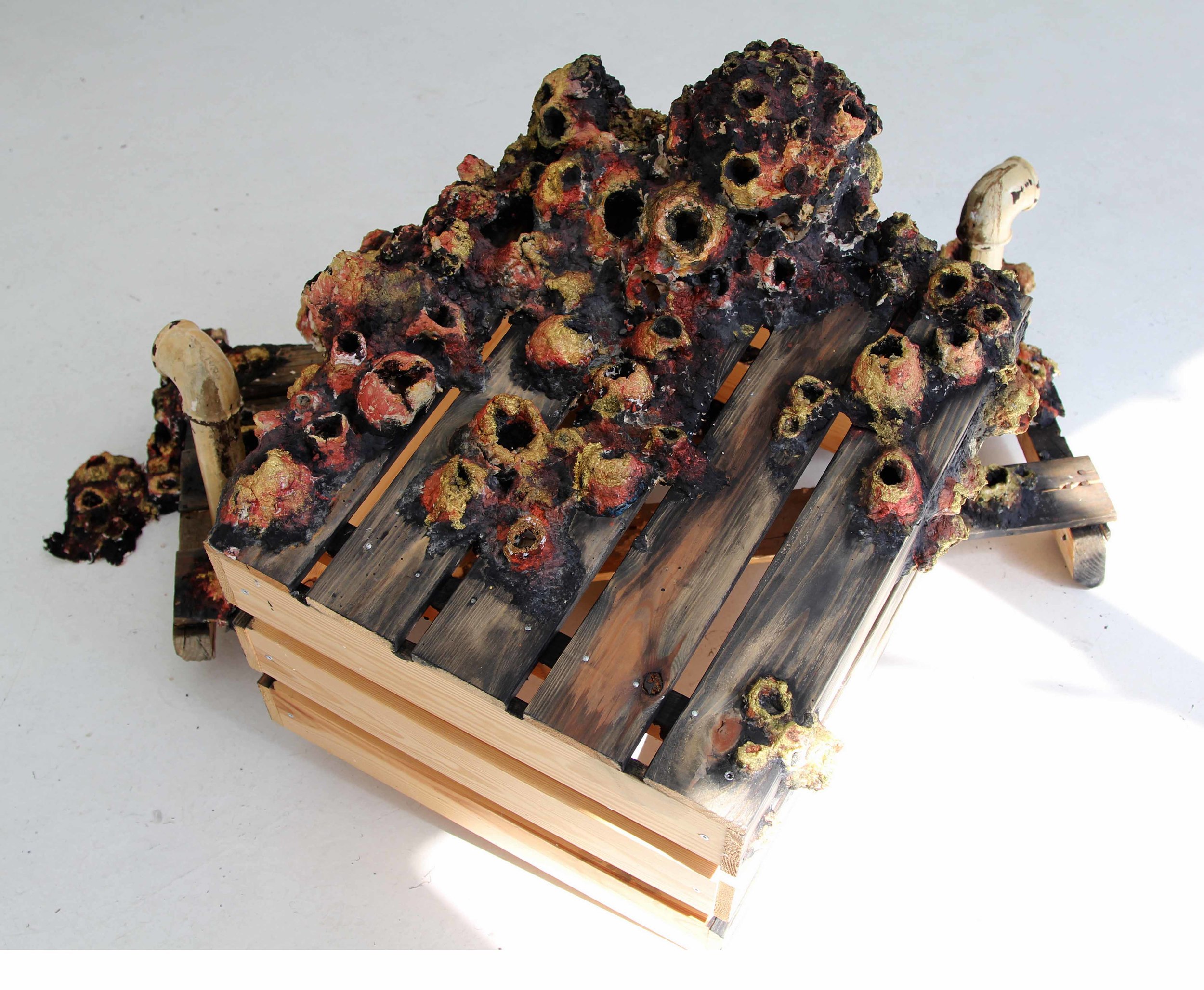 Ta barnacle. Sculptural installation in situ , Galerie Yellow Fish, Montreal. Handmade recycled paper sculpture with paint and ink, wooden crates, antique plumbing pipes. 
