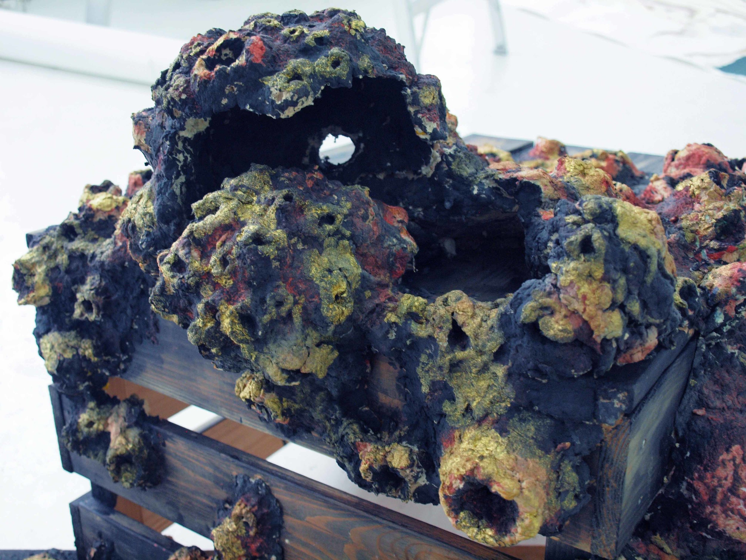 Ta barnacle. Sculptural installation in situ , Galerie Yellow Fish, Montreal. Handmade recycled paper sculpture with paint and ink, wooden crates, antique plumbing pipes. 