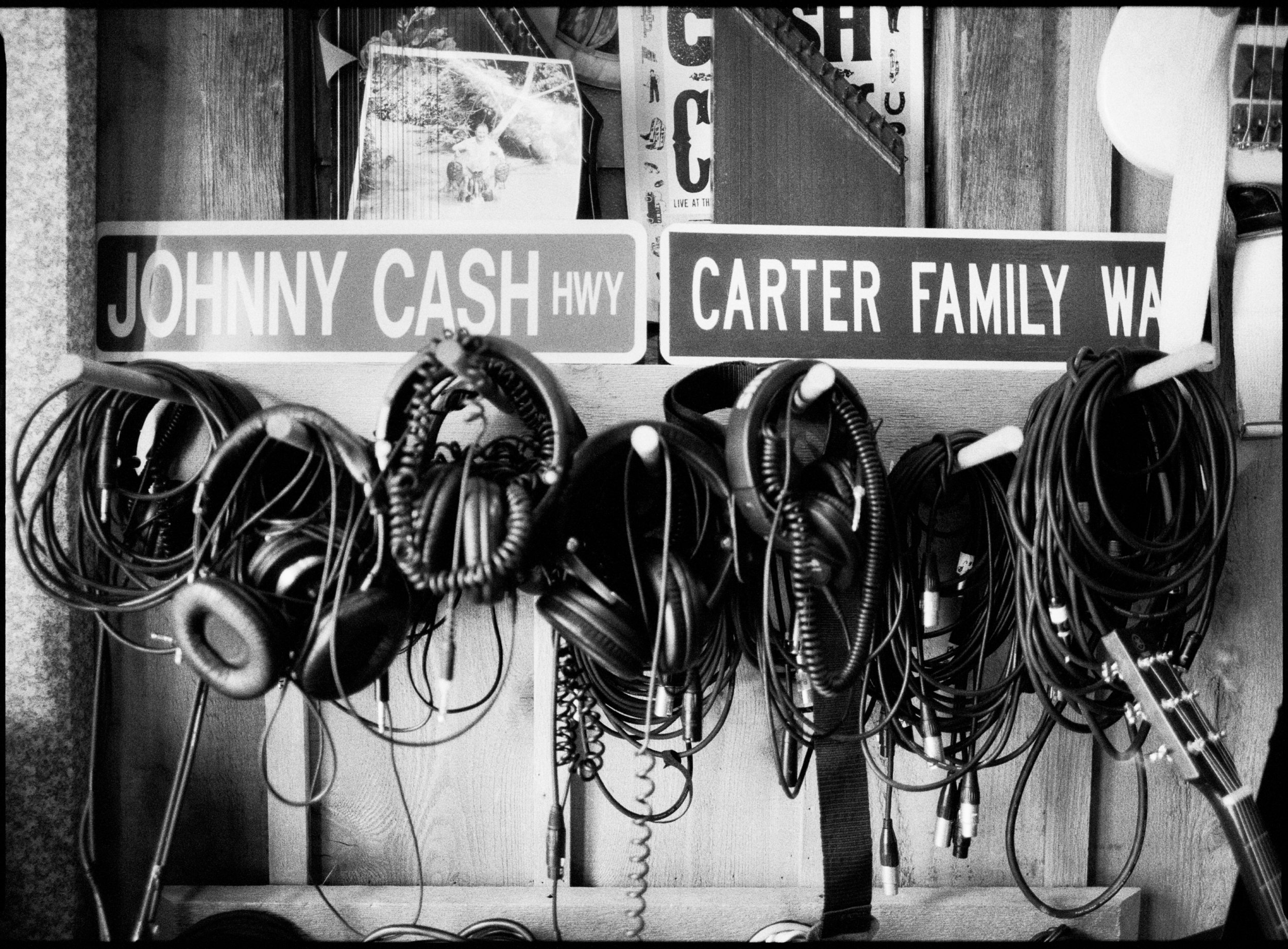 Cables and Headphones against Cash family memorabilia inside the studio.