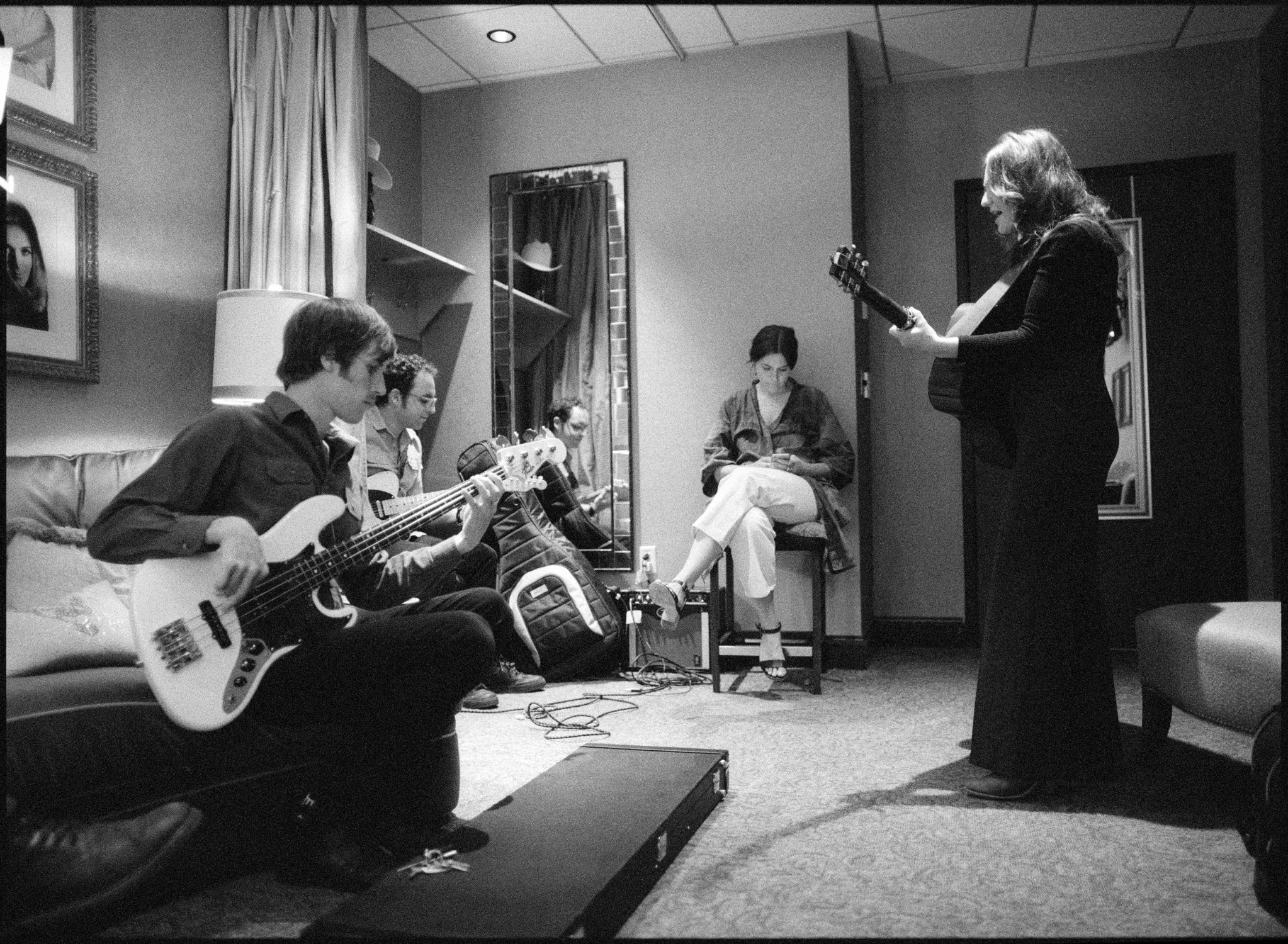 Kelsey Waldon, Alec Newnam, and Mike Khalil rehearsing backstage in the dressing room of the Opry